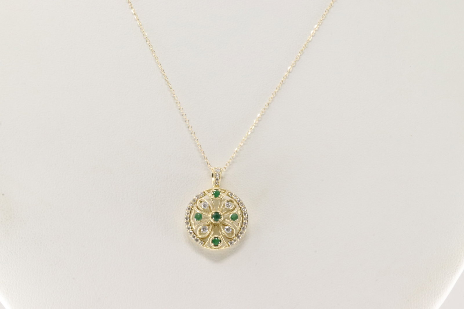 Emerald & Diamond Pendant / Necklace 14Kt.: Ladies 14Kt Yellow Gold Emerald & Diamond Pendant / Necklace. This Necklace has Pendant with 5 Emeralds with 34 Round Diamonds. Diamonds weight: 0.32ctw. Emeralds weight: 0.16ctw. Necklace length: