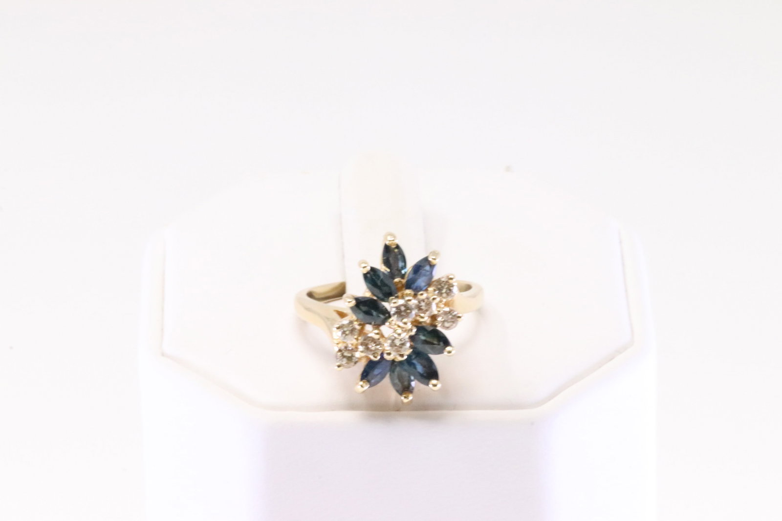 Sapphire & Diamond Ring 14Kt.: Ladies 14Kt Yellow Gold Sapphire & Diamond Ring. Ring has 8 Sapphire's with 8 round Diamonds. Diamonds weight approx: 0.37ctw. Ring size: 7.50. Total weight: 5.60 Grams.