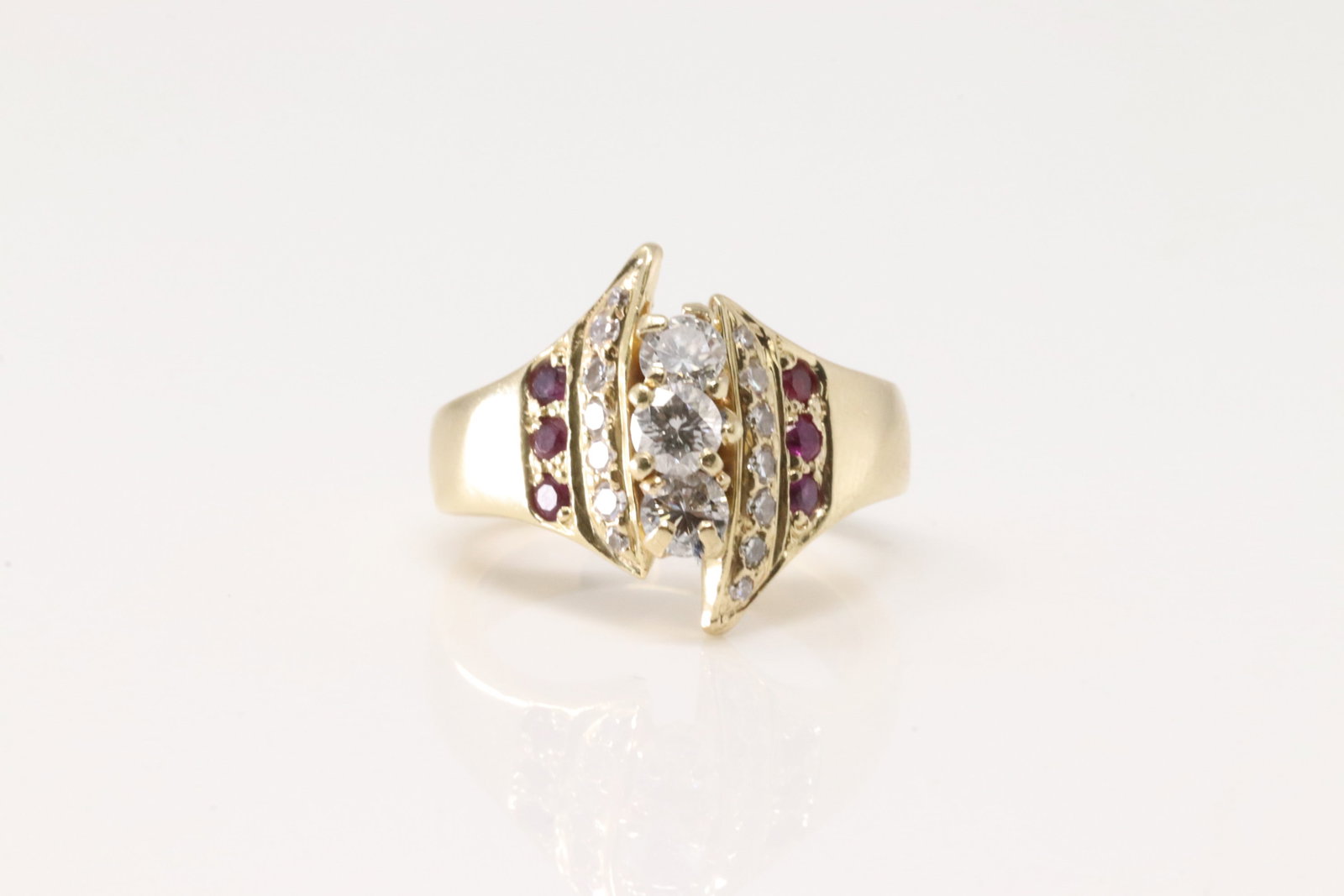 Elegant Ruby & Diamond Ring 14Kt.: Ladies 14Kt Yellow Gold Ruby & Diamond Ring. This is elegant ring has 3 rows with 17 brilliants diamonds and 6 rubies. Diamonds weight approx: 0.8ctw. Ring size: 6.00. Total weight: 8.40 Grams.