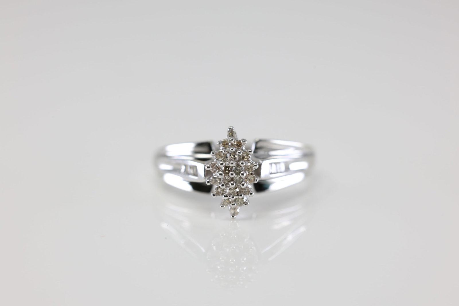 Diamond Ring 10Kt.: Ladies 10Kt White Gold Diamond Ring. This Ring has Goregeous Round Diamonds. Ring Size: 7.00. Total Weight: 2.54 Grams.