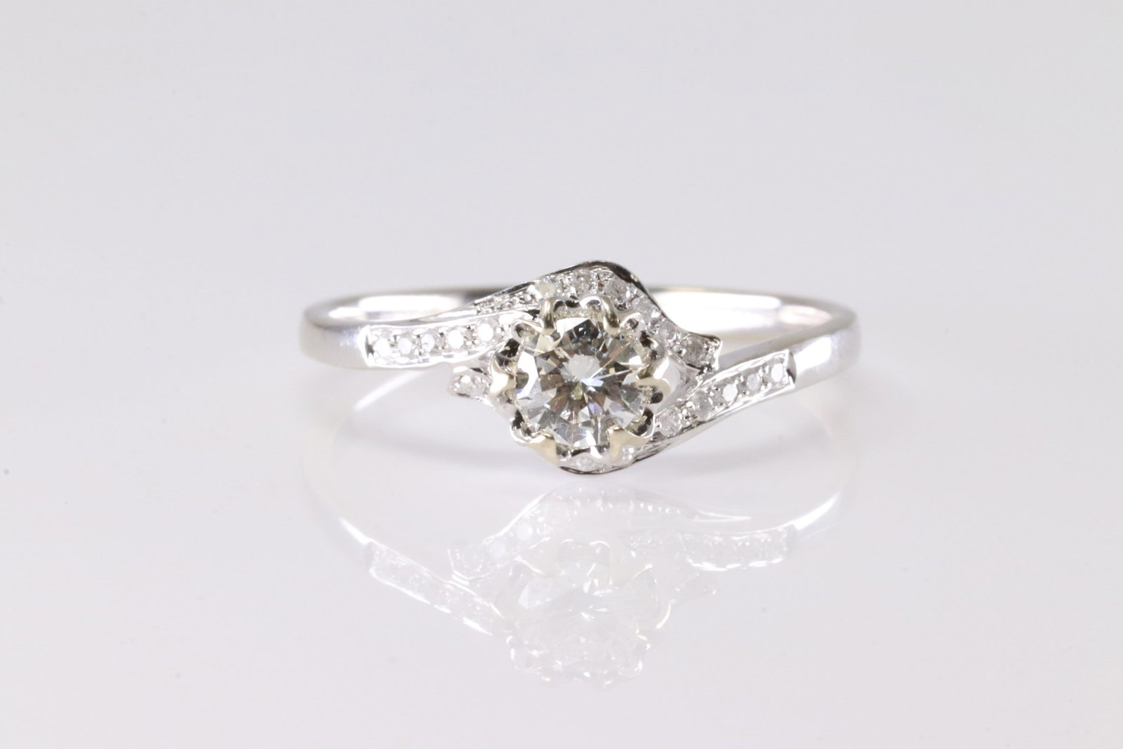 Diamond Ring 14Kt.: Ladies 14Kt White Gold Diamond Ring. This Ring has 23 Round Sparkling Diamonds. Diamond Approx Weight: 0.50ctw. Ring Size: 7.50. Total Weight: 2.30grams.