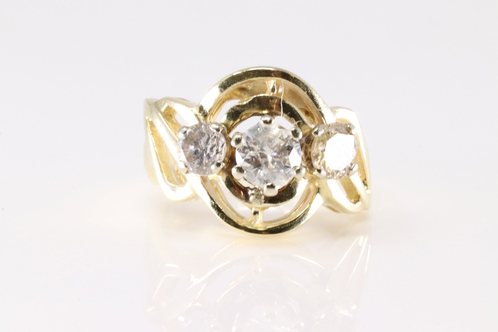 Diamond Ring 14Kt.: Ladies 14Kt Yellow Gold Diamond Ring. This Ring has 3 Round Sparkling Diamonds. Diamond Approx Weight: 1.ctw. Ring Size: 4.50. Total Weight: 6.40grams.