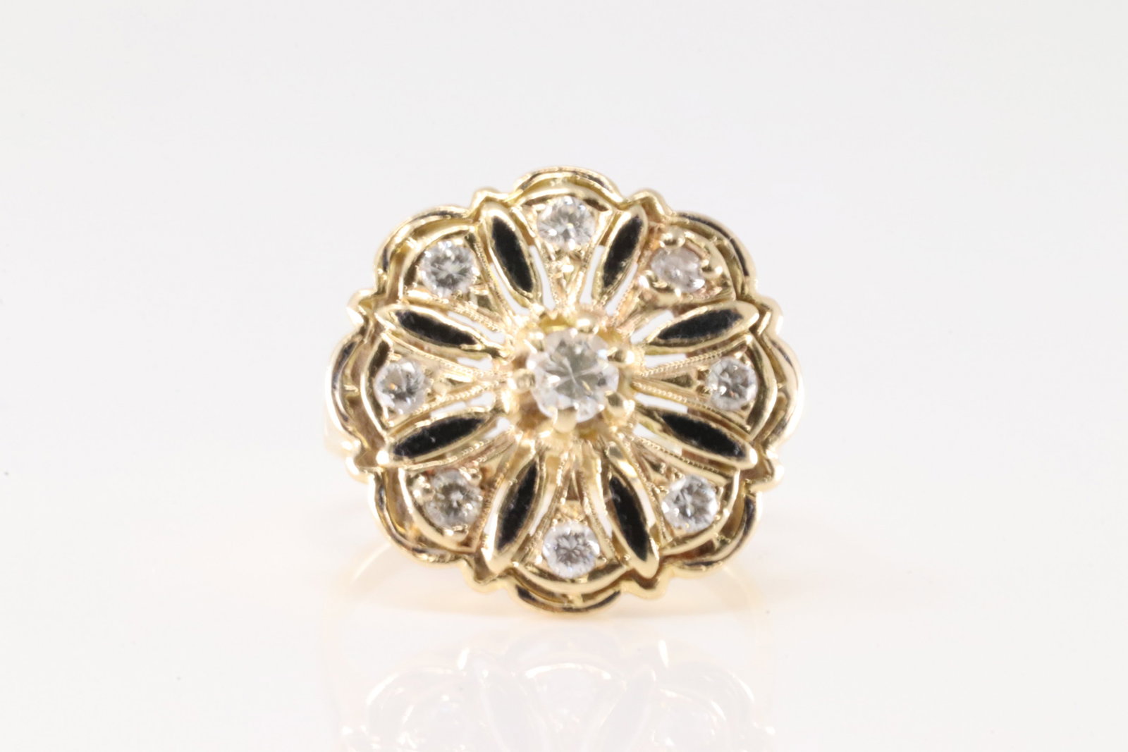 Floral Diamond Ring 14Kt.: Ladies 14Kt Yellow Gold Floral Diamond Ring. Ring has floral deisgn with 9 round brilliants diamonds. Diamonds weight approx: 0.40ctw. Ring size: 6.25. Total weight: 4.60 Grams.