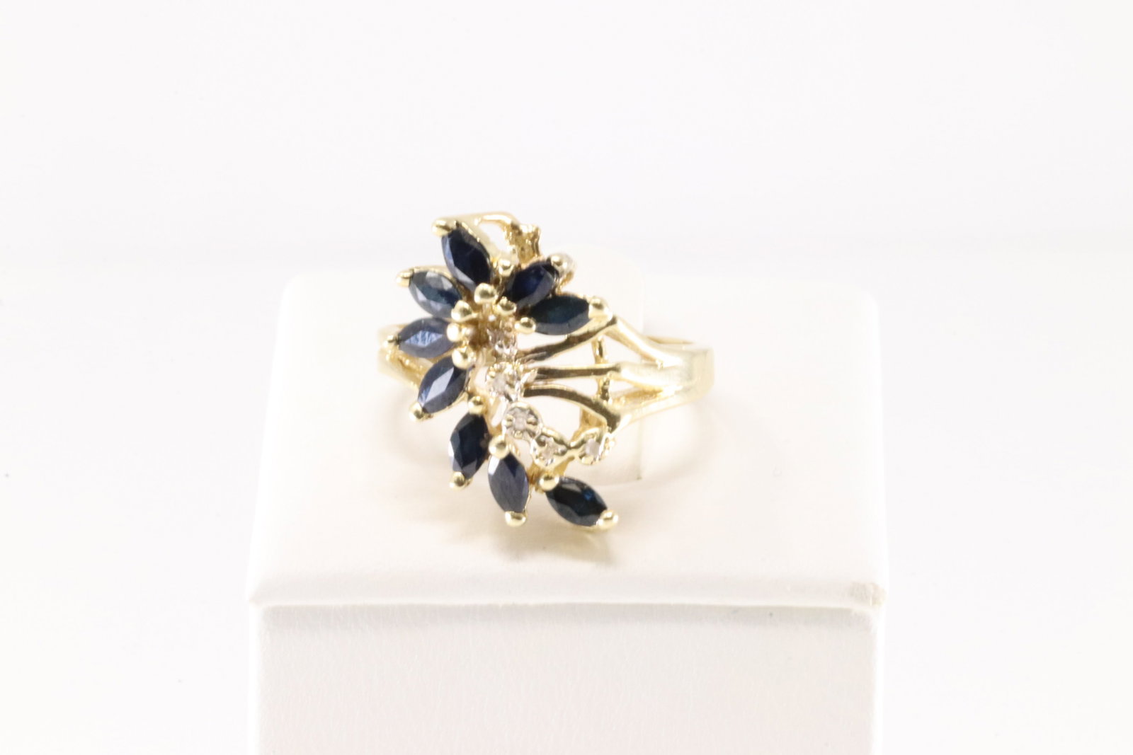 Sapphire & Diamond Ring 14Kt.: Sapphire & Diamond Ring 14Kt. This Charming Ring has 9 Blue Marquise Sapphire with 5 Sparkling Diamonds. Ring size: 7.50. Total weight: 5.30 Grams.