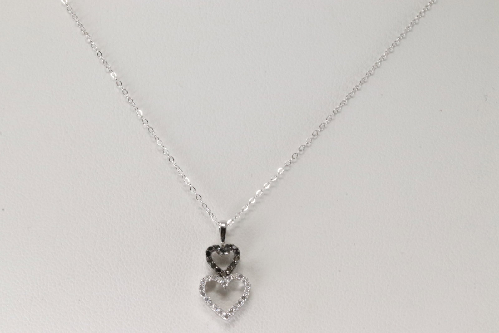 Diamond Heart Pendant / Necklace 14Kt.: 14Kt White Gold Diamond Heart Pendant / Necklace. This Necklace has Heart Pendant with 36 Black & White Diamonds. Diamonds weight: 0.18ctw. Necklace length: 18.00"