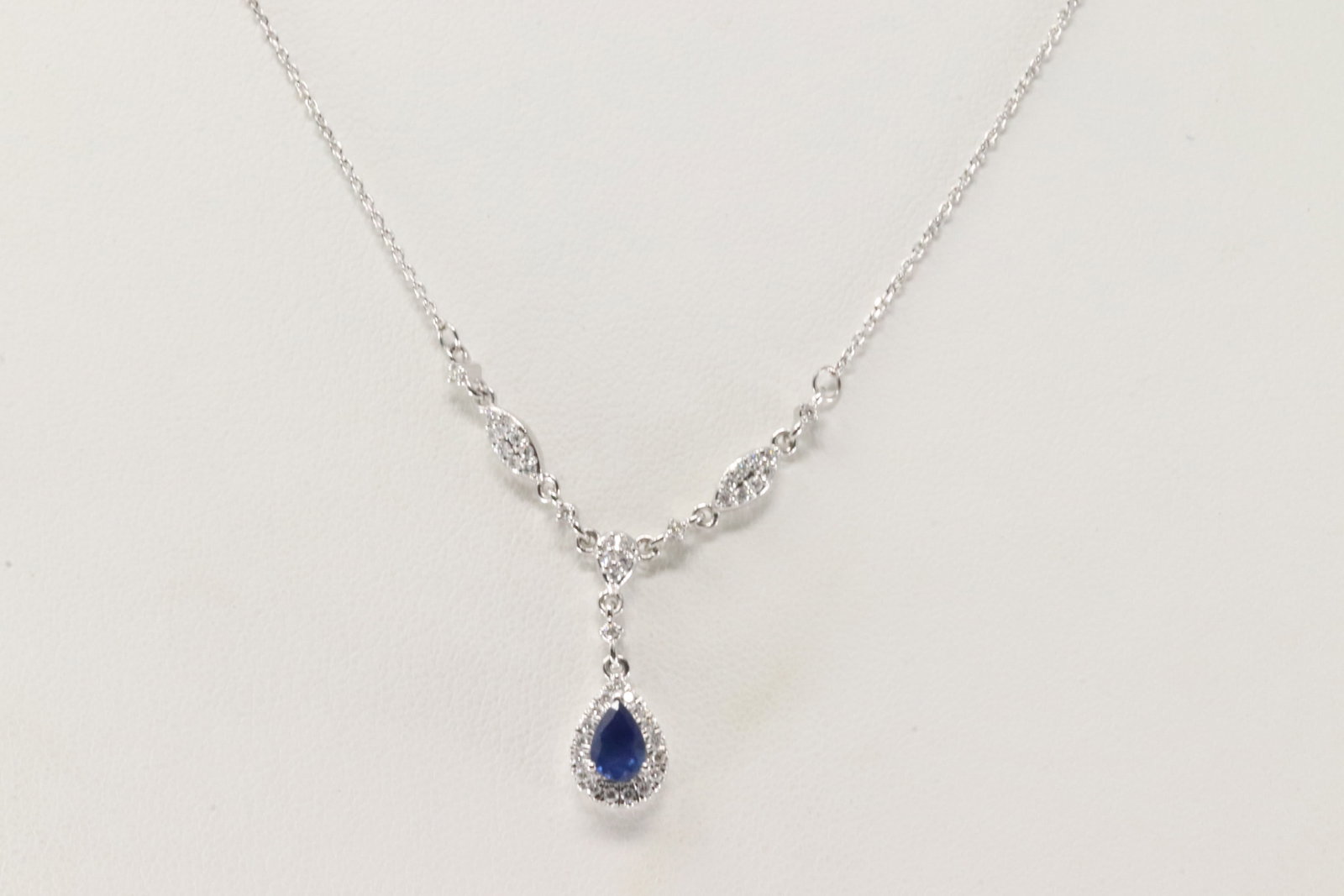 Sapphire & Diamond Pendant / 14Kt. Necklace: Ladies 14Kt White Gold Sapphire & Diamond Pendant / Necklace. This Necklace has A Pendant with A Pear-Shape Sapphire & 43 Round Diamonds. Diamonds weight: 0.24ctw. Sapphire weight: 0.60ctw. Necklace