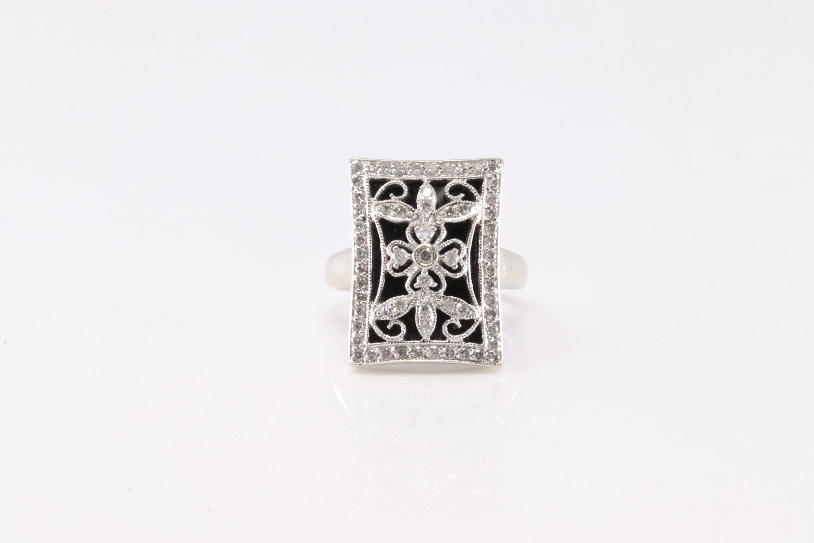 Vintage Black Onyx Diamond Ring 14Kt.: Vintage Black Onyx Diamond Ring 14Kt. This Ring has Gorgeous Design With 61 Round Sparkling Diamonds. Diamond Approx Weight: 0.65 ctw Ring Size: 6.00. Total Weight: 5.57 Grams.