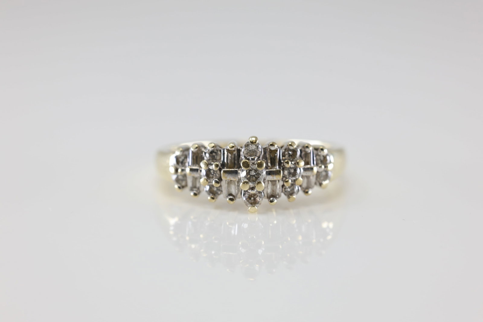 Diamond Ring 10Kt.: Ladies 10Kt Yellow Gold Diamond Ring. This Ring has Round / Sparkling Baguette Diamonds. Diamond Weight Approx: 0.50 ctw. Ring Size: 8.50. Total Weight: 3.49 Grams.