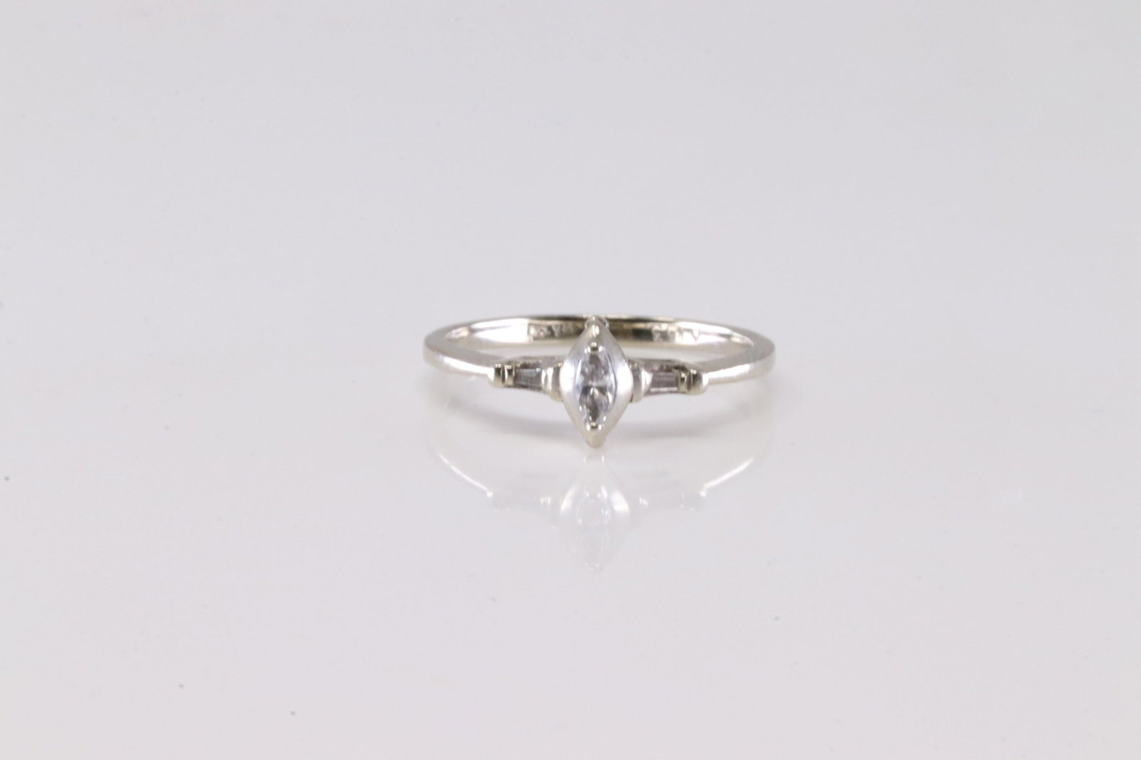 Diamond Ring 14Kt.: Ladies 14Kt White Gold Diamond Ring. Thia Charming Ring has Oval Solitaire Diamond In The Center. Diamond Approx Weight: 0.30 ctw Ring Size: 5.25.