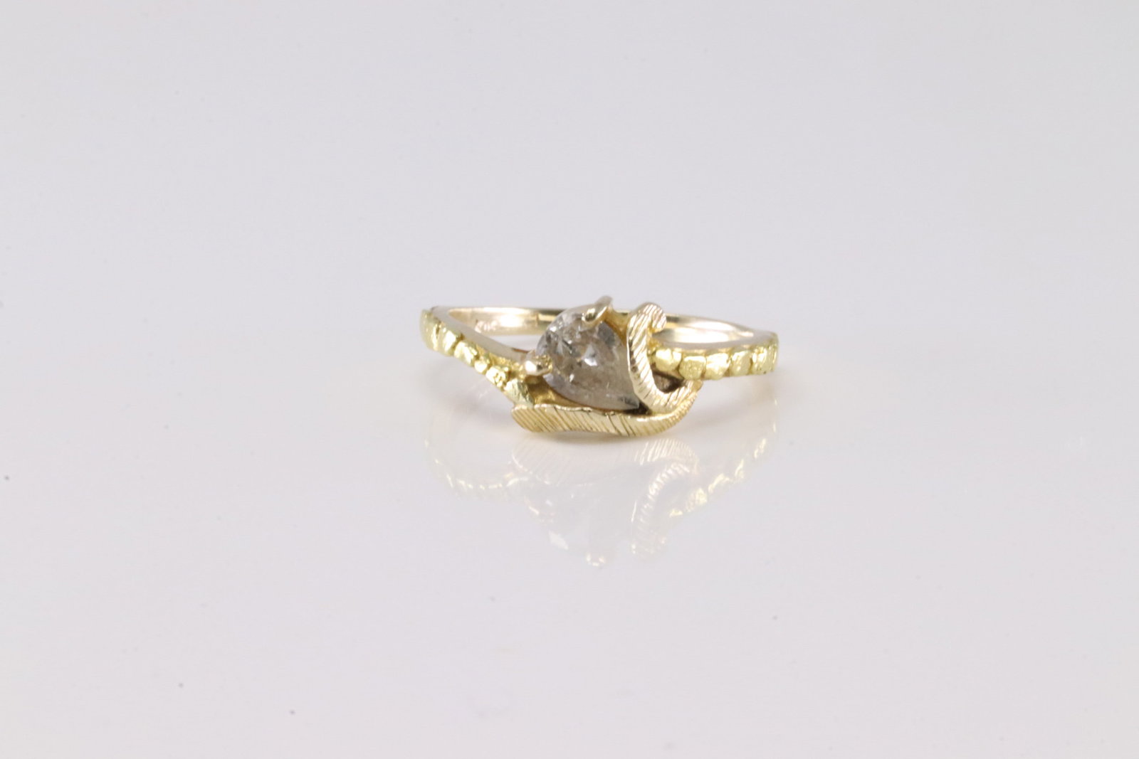 Diamond Ring 10Kt.: Ladies 10Kt Yellow Gold Diamond Ring. This Elegant Ring has Pear Solitaire Diamond. Diamond Approx Weight: 0.40 ctw Ring Size: 4.75.