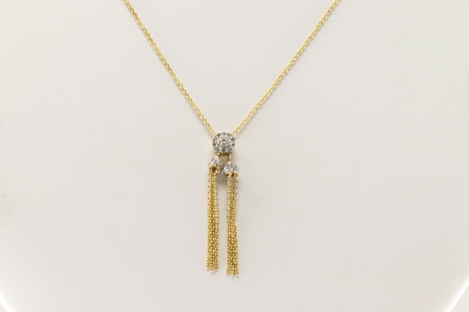 Tassel Dazzle Diamond Necklace 10Kt.: Ladies 10Kt Yellow Gold Tassel Dazzle Diamond Necklace. This Elegant Tassel Necklace has Sparkling Round Diamonds. Necklace length: 26.00" Total weight: 4.60 Grams.