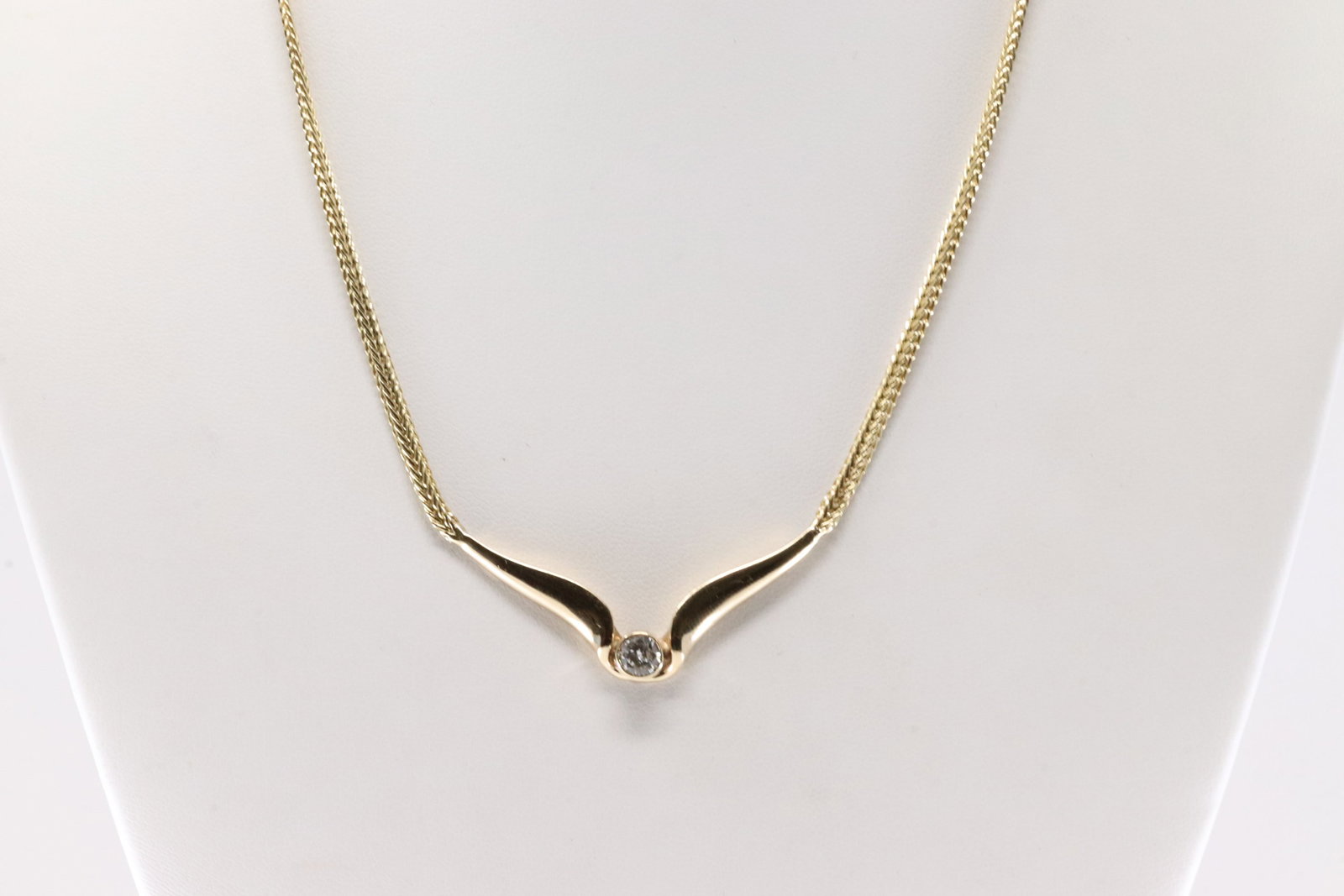 Diamond Necklace 14Kt.: Ladies 14Kt Yellow Gold Diamond Necklace. This Charming Necklace has Solitaire Sparkling Diamond In The Center. Diamond Weight Approx: 0.50 ctw Necklace Length: 16.00. Total Weight: 12.7 Grams.