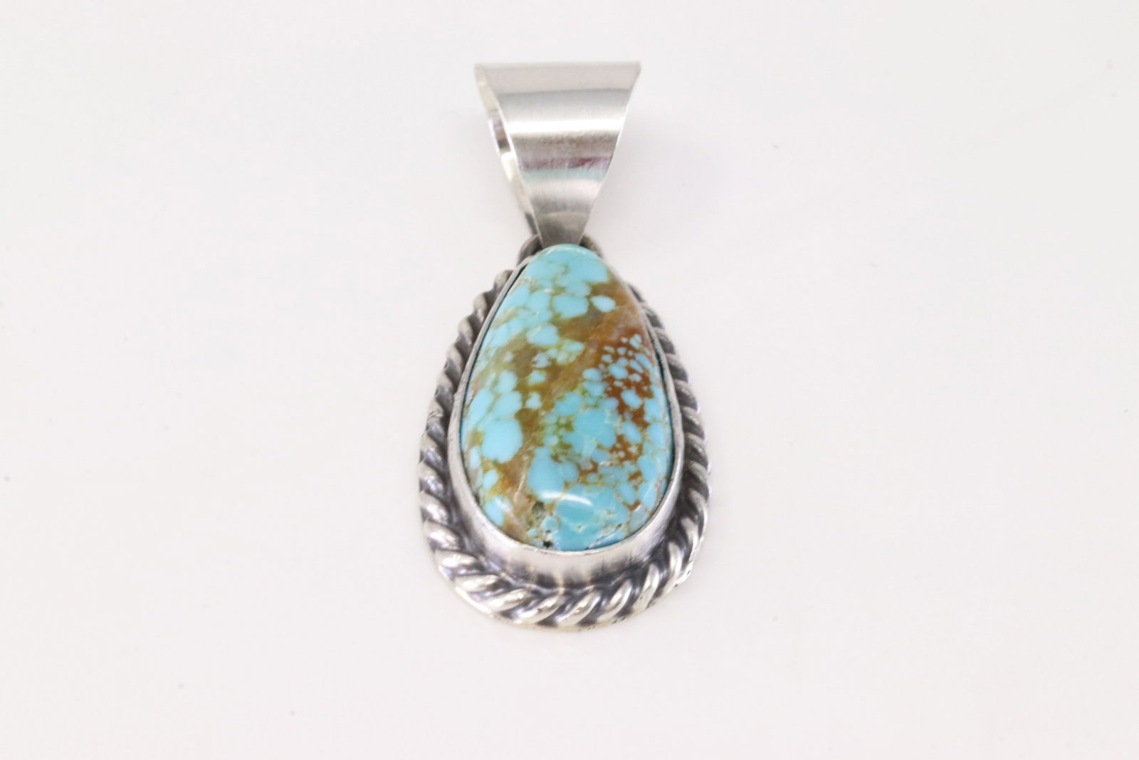 Native America Navajo Sterling Silver Turquoise Pendant By SE.: This is a Native America Navajo Sterling Silver Turquoise Pendant By SE. Stamp SE.