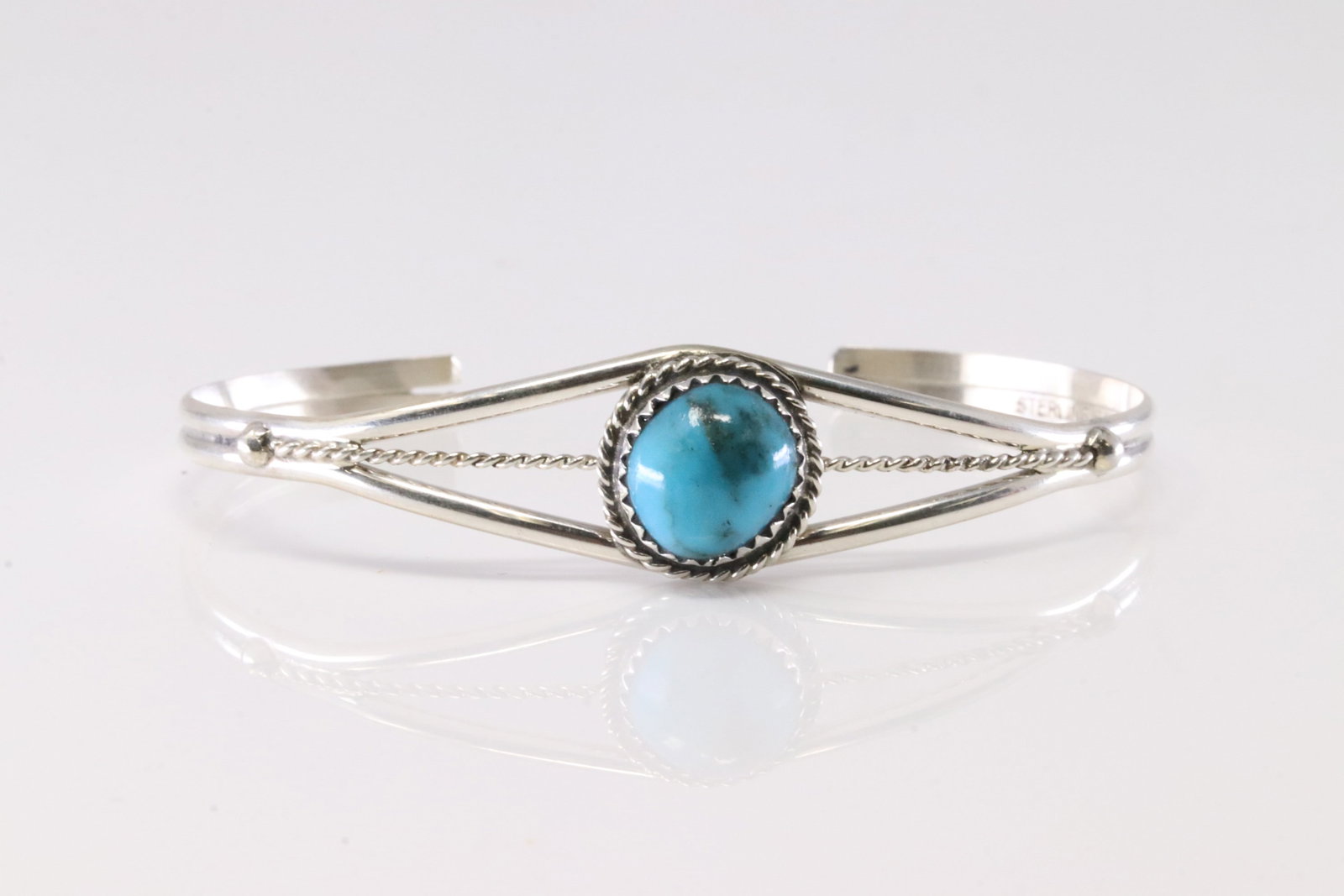 Native America Navajo Sterling Silver Turquoise Bracelet Cuff By EW.: This is a Native America Navajo Sterling Silver Turquoise Bracelet Cuff By EW. Stamp EW.