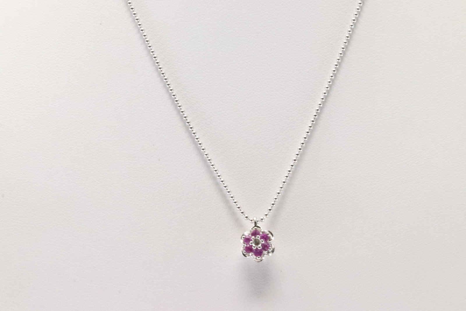 Ruby & Diamond Pendant / Necklace 14Kt.: Ladies 14Kt White Gold Ruby & Diamond Pendant / Necklace. This charming pendant has pink rubies with round diamonds and a 14k white necklace. Neckalce Length: 16.00. 3.60: Grams.