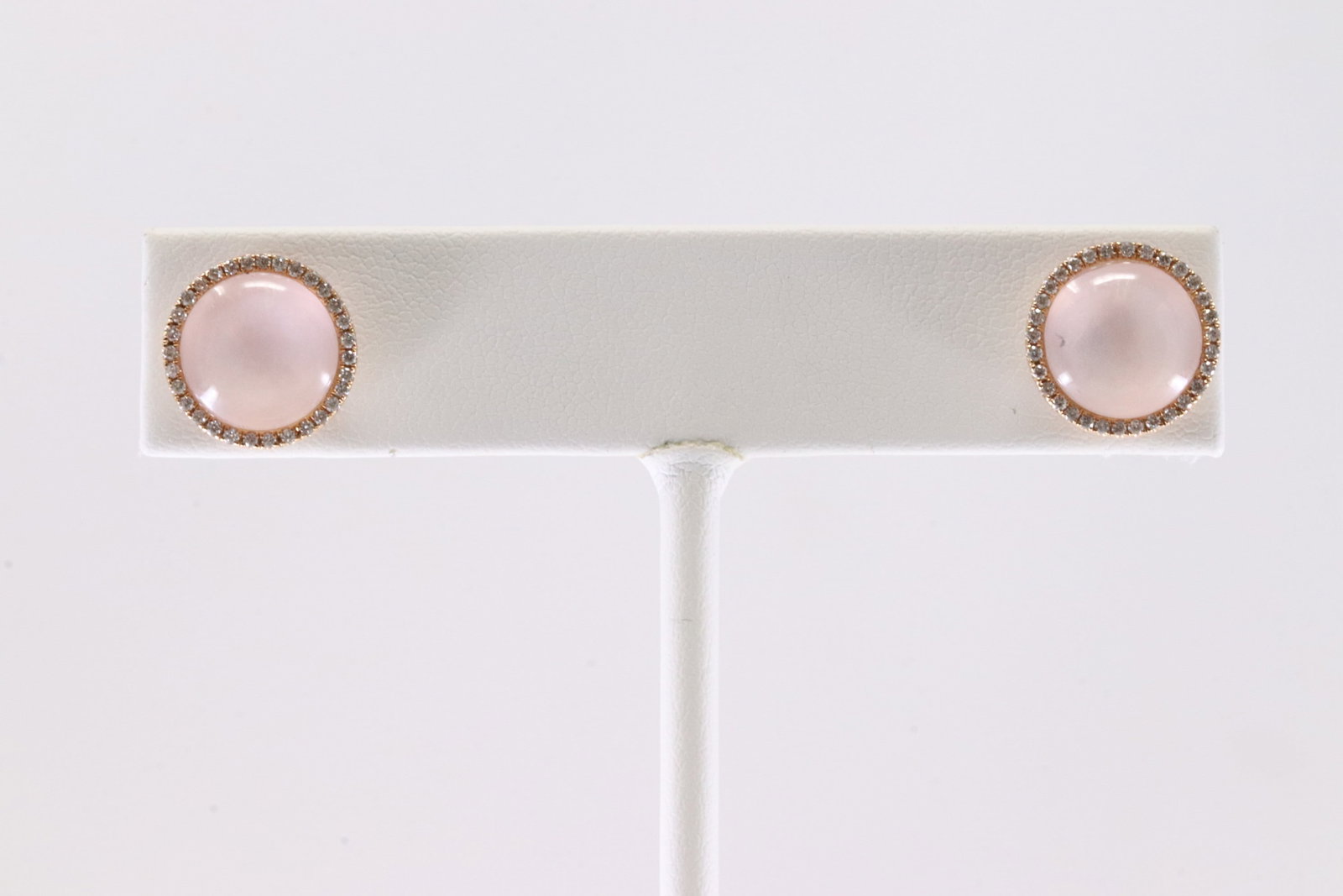 Quartz & Diamond Stud Earring 18Kt.: Ladies 18Kt Rose Gold Quartz & Diamond Stud Earring. This Elegant Stud Earring's has Quartz Stone Surrender By Sparkling Diamonds. Total weight: 3.36 Grams.