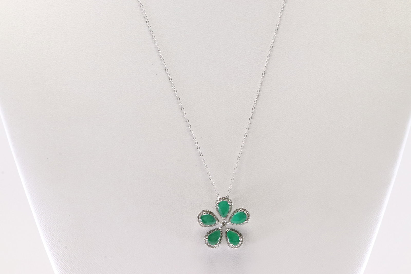 Emerald & Diamond Flower Pendant / Necklace 14Kt.: 14Kt White Gold Emerald & Diamond Flower Pendant / Necklace. This Necklace has Elegant Flower Pendant with 5 Pear-Shape Emeralds and 81 round Diamonds. Necklace length: 20.00" Total weight: 3.70