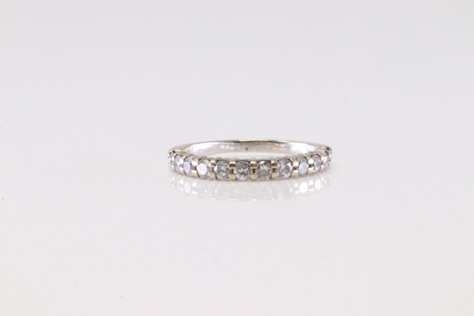 Diamond Ring 14Kt.: Ladies 14Kt White Gold Diamond Ring. This Charming Ring has 12 Round Sparkling Diamonds. Diamond Approx Weight: 0.25 ctw Ring Size: 4.00.