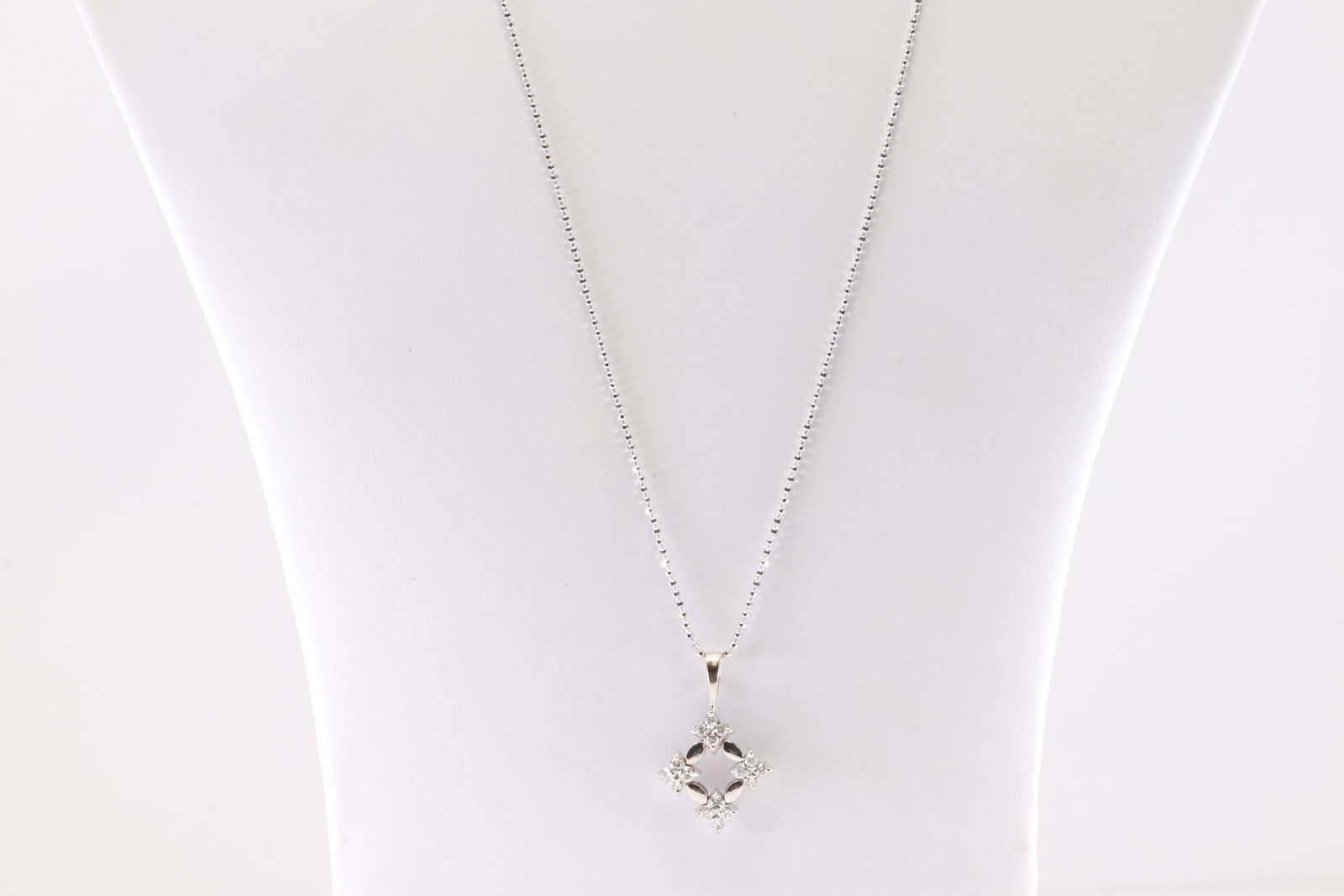 Diamond Pendant 18Kt.: Ladies 18Kt White Gold Diamond Pendant. Pendant has 16 round Diamonds with A 14k Necklace. Diamonds Approx Weight: 0.50ctw.Necklace Length: 22.00". Total Weight: 4.90 Grams.