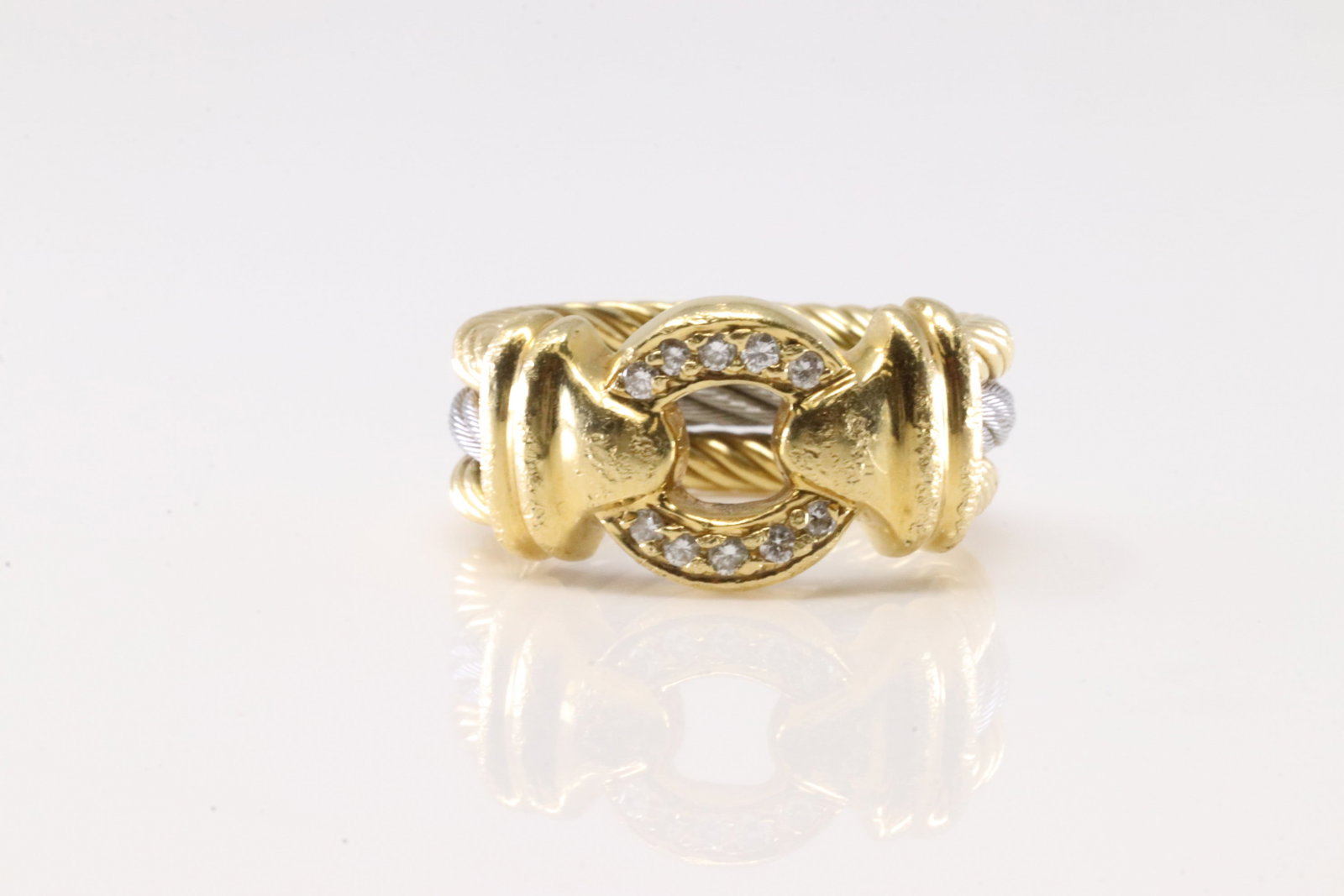 Signed Diamond Ring 18Kt.: Signed 18Kt Yellow Gold Diamond Ring. Ring has a modern style with 10 round sparkling diamonds & a row of steel steen. Diamonds Approx Weight: 0.35ctw. Ring Size: 5.25. Total Weight: 9.90 Grams.