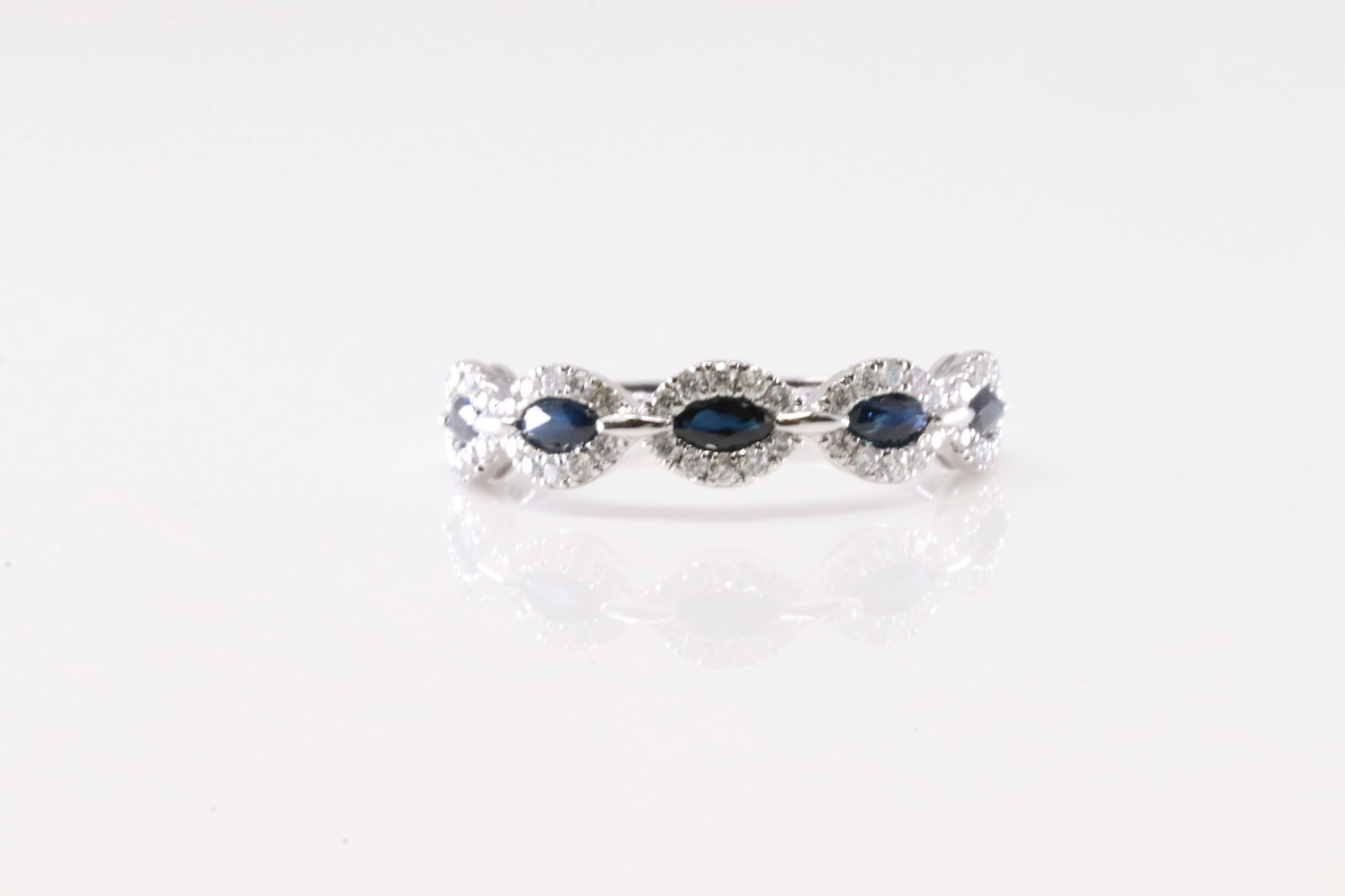 Sapphire & Diamond Ring 14Kt.: Ladies 14Kt White Gold Sapphire & Diamond Ring. This Elegant Ring has 5 Blue Sapphires with 54 round Diamonds. Diamonds Weight: 0.27ctw. Sapphires Weight: 0.58ctw. Ring Size: 6.50. Total Weight: 2.30 
