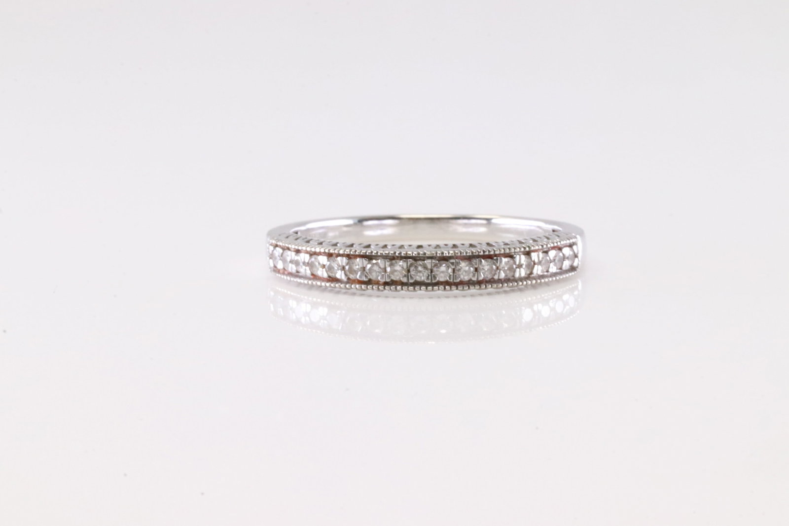Diamond Ring 10Kt.: Ladies 10Kt White Gold Diamond Ring. This Charming Ring has 17 Round Sparkling Diamonds. Diamond Approx Weight: 0.25ctw. Ring Size: 6.75.