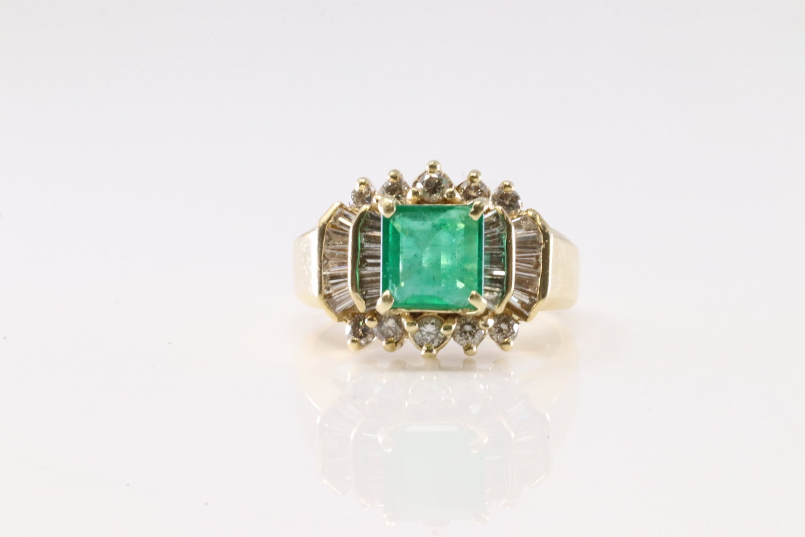 Elegant Emerald & Diamond Ring 14Kt.: Ladies 14Kt Yellow Gold Elegant Emerald & Diamond Ring. This Elegant Ring has Square Cut Emerald with diamond accent Baguette & Round Diamonds. Diamonds Approx Weight: 1.00cttw. Ring Size: 5.50.