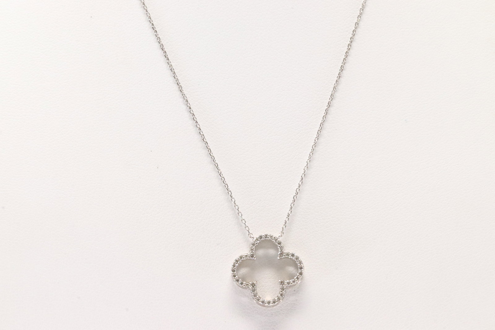 Diamond Necklace 18Kt.: 18Kt White Gold Diamond Necklace. This Elegant 18K Necklace has Trevol Charm with Sparkling Diamonds. Necklace length: 16.00" Total weight: 2.42 Grams.
