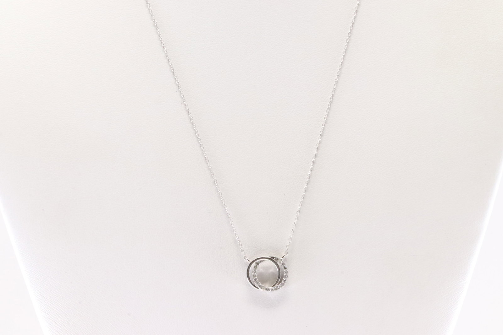 Diamond Necklace 10Kt.: 10Kt White Gold Diamond Necklace. This Necklace has A Charming Circle Charm with Sparkling Diamonds. Diamonds weight: 0.10ctw. Necklace length: 18.00"