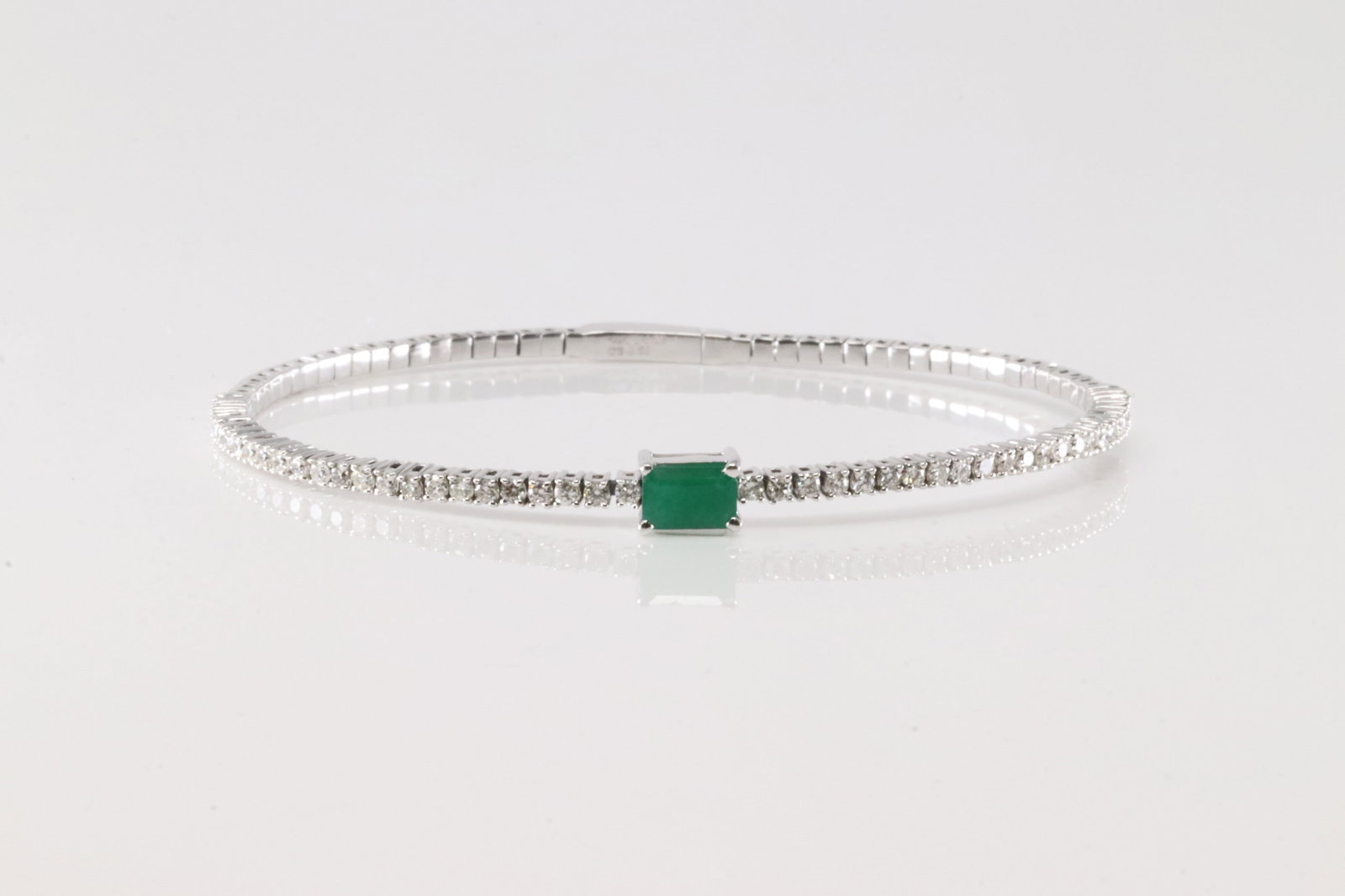 Emerald & Diamond Bangle Bracelet 14Kt.: 14Kt White Gold Emerald & Diamond Bangle Bracelet. This Elegant Bangle Bracelet has Green Emerald Surrender By 48 Brilliants Diamonds. Diamonds weight: 0.85ctw. Total weight: 6.50 Grams.