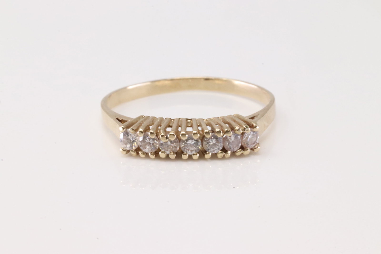 Diamond Ring 10Kt.: Ladies 10Kt Yellow Gold Diamond Ring. This Charming Ring has 7 Sparkling Diamonds. Diamonds weight Approx: Ring size: 7.25.