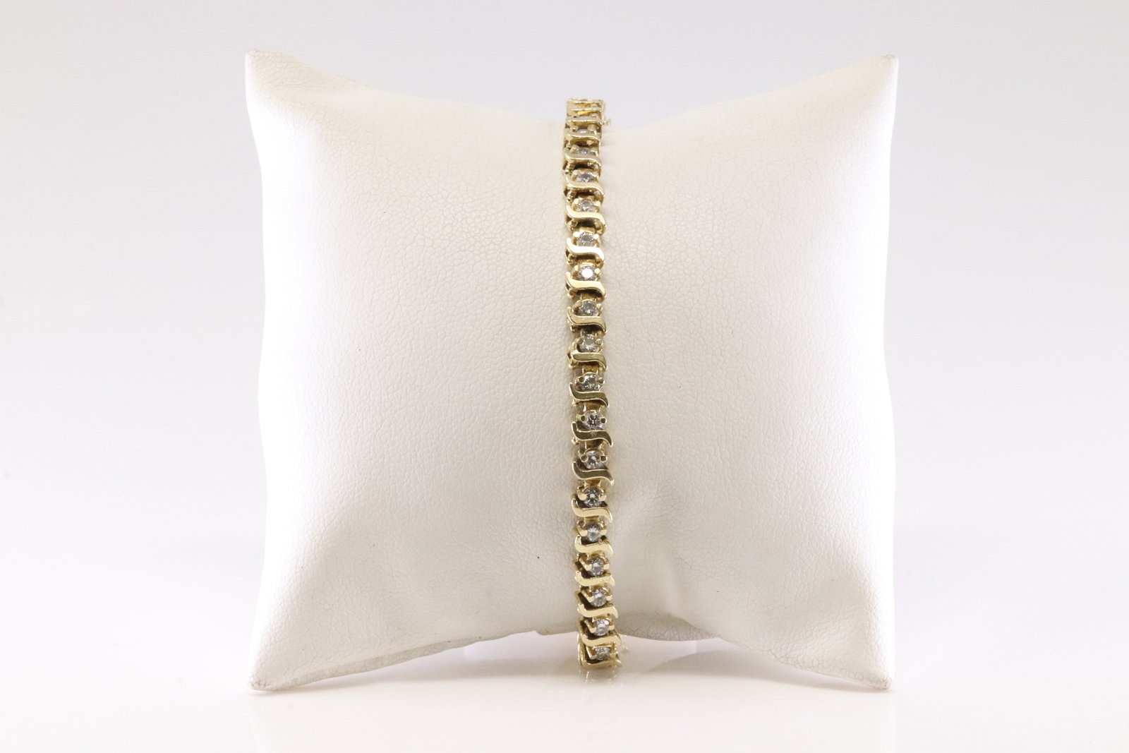 Diamond Bracelet 14Kt.: Ladies 14Kt Yellow Gold Diamond Bracelet. Elegant Bracelet has 44 Round Sparkling Diamonds. Diamond Approx Weight: 2.00ctw. Bracelet Length: 8.00. Total Weight: 12.84 Grams.
