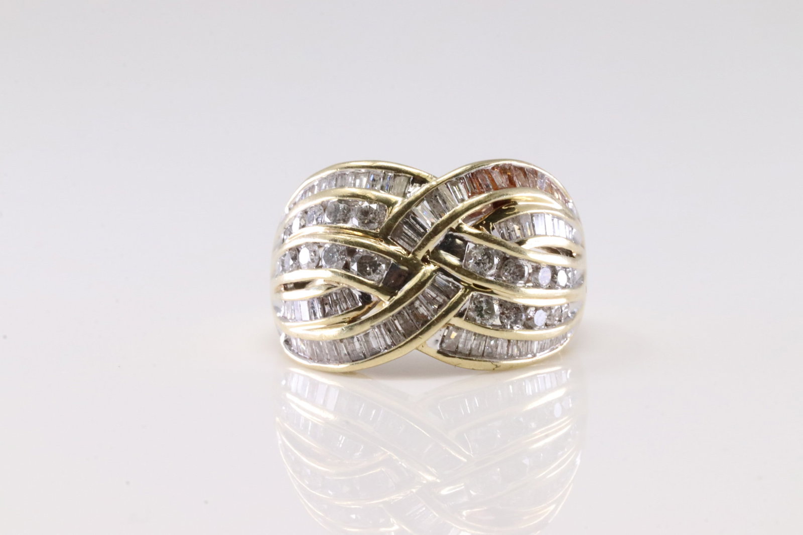 Diamond Ring 10Kt.: Ladies 10Kt Yellow Gold Diamond Ring. This Ring has 84 Baguette / 20 Round Sparkling Diamonds. Diamond Approx Weight: 2.00ctw. Ring Size: 9.50. Total Weight: 8.10 Grams.