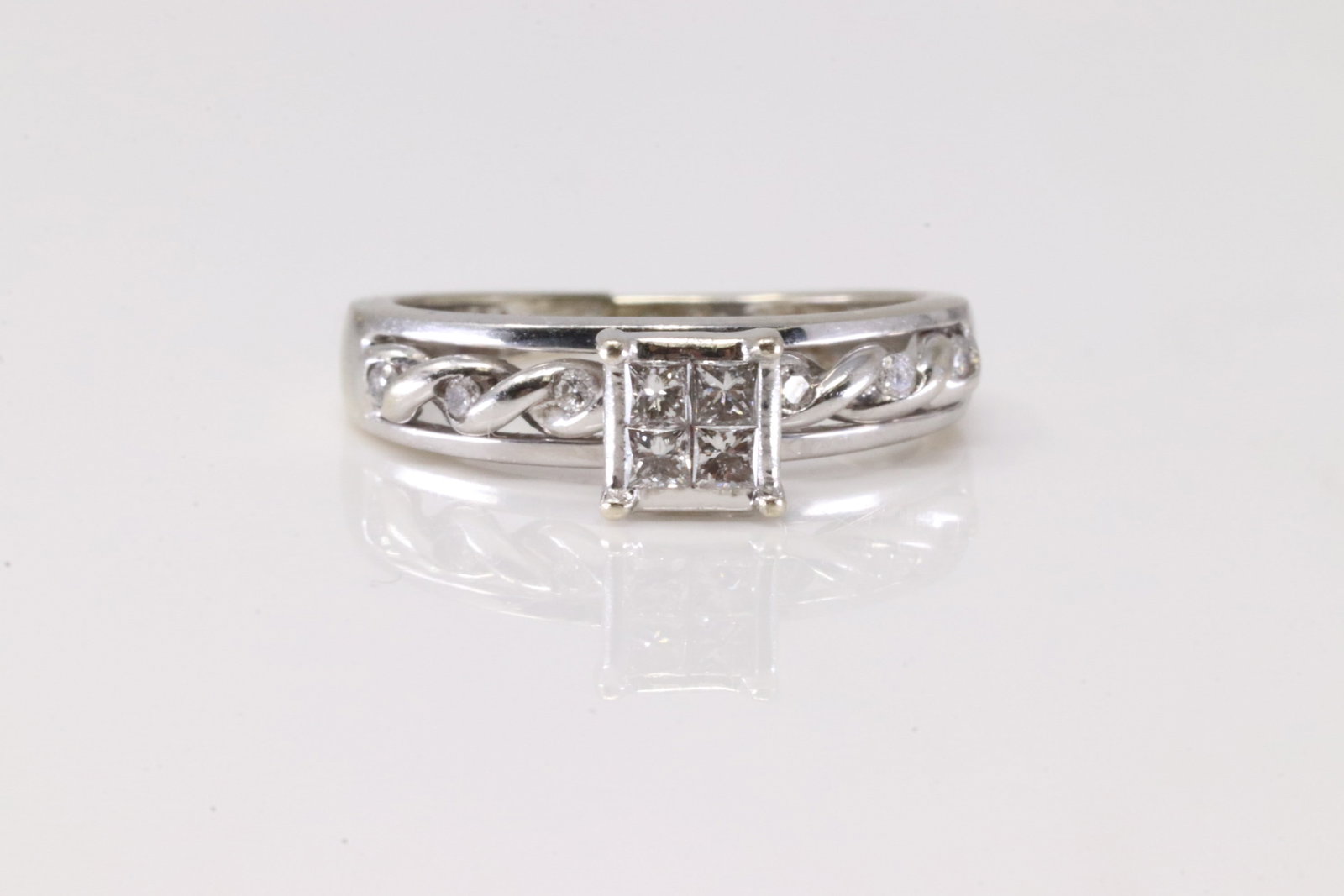 Diamond Ring 14Kt.: Ladies 14Kt White Gold Diamond Ring. This Elegant Engagement Ring has 10 Sparkling Diamonds. Ring size: 4.75. Total weight: 2.76 Grams.