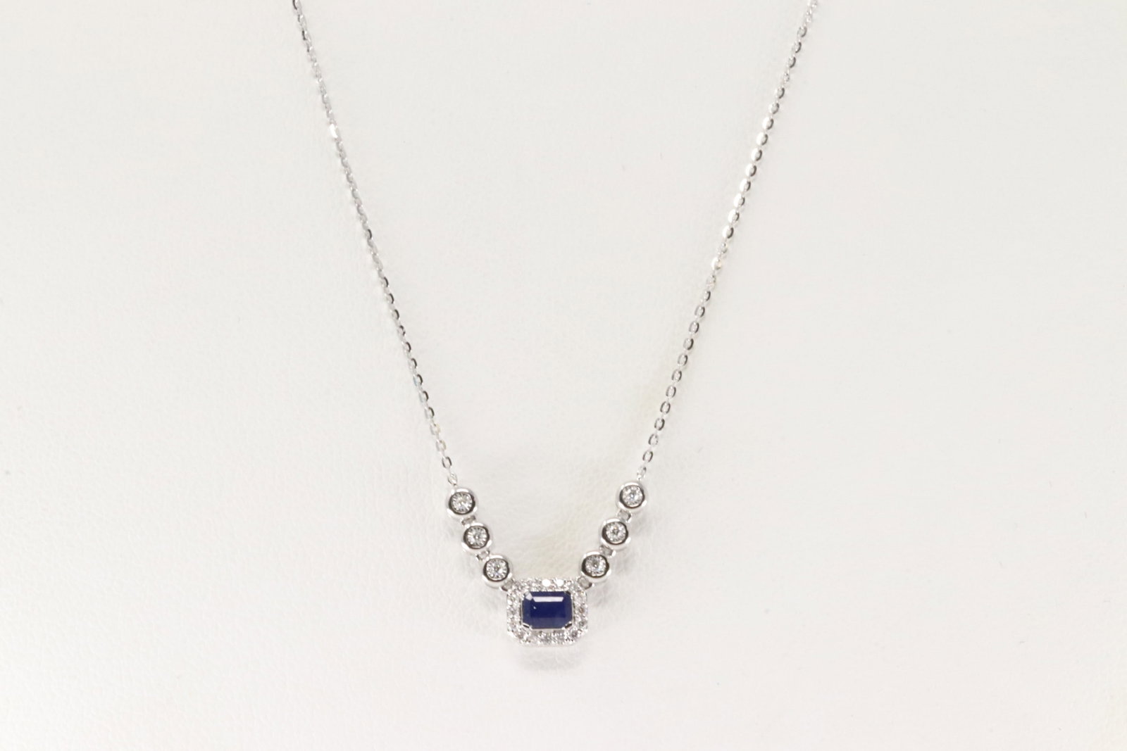 Sapphire & Diamond Necklace 14Kt.: Ladies 14Kt White Gold Sapphire & Diamond Necklace. This Necklace has Charm with Blue Sapphire and Brilliants Diamonds. Diamonds weight: 0.11ctw. Sapphire weight: 0.29ctw. Necklace length: 18.00" Tota