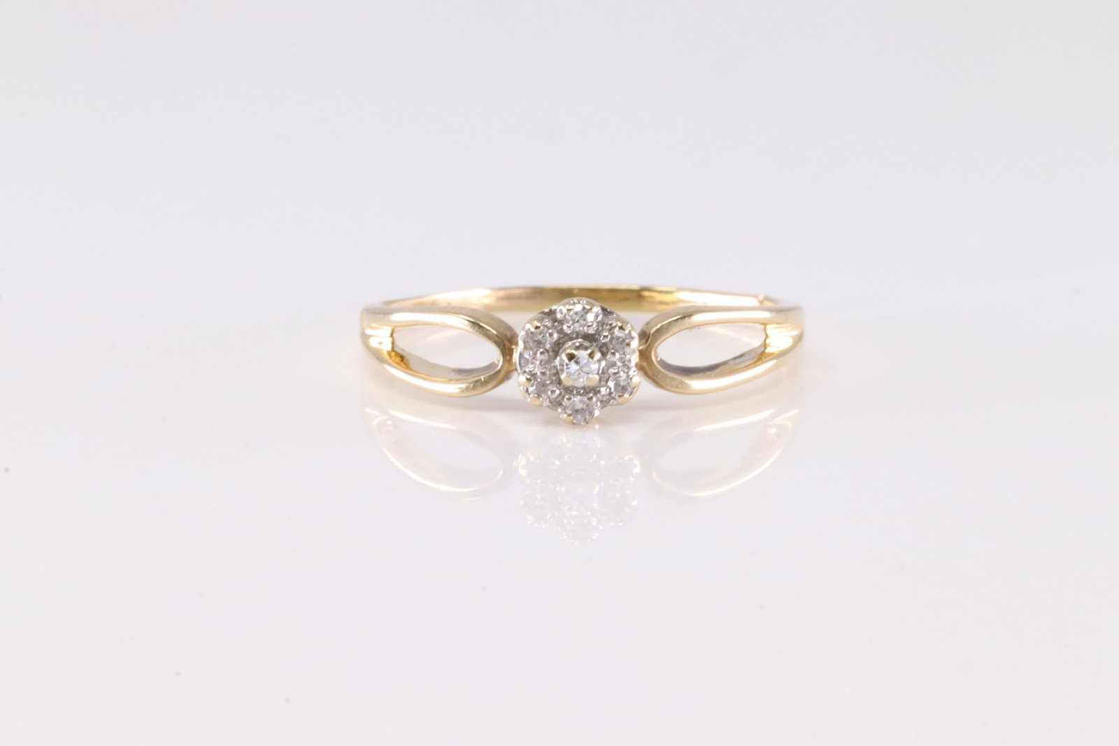 Diamond Ring 10Kt.: Ladies 10Kt Yellow Gold Diamond Ring. This Ring has Flower Design with Sparkling Diamonds. Ring size: 10.00. Total weight: 2.12 Grams.