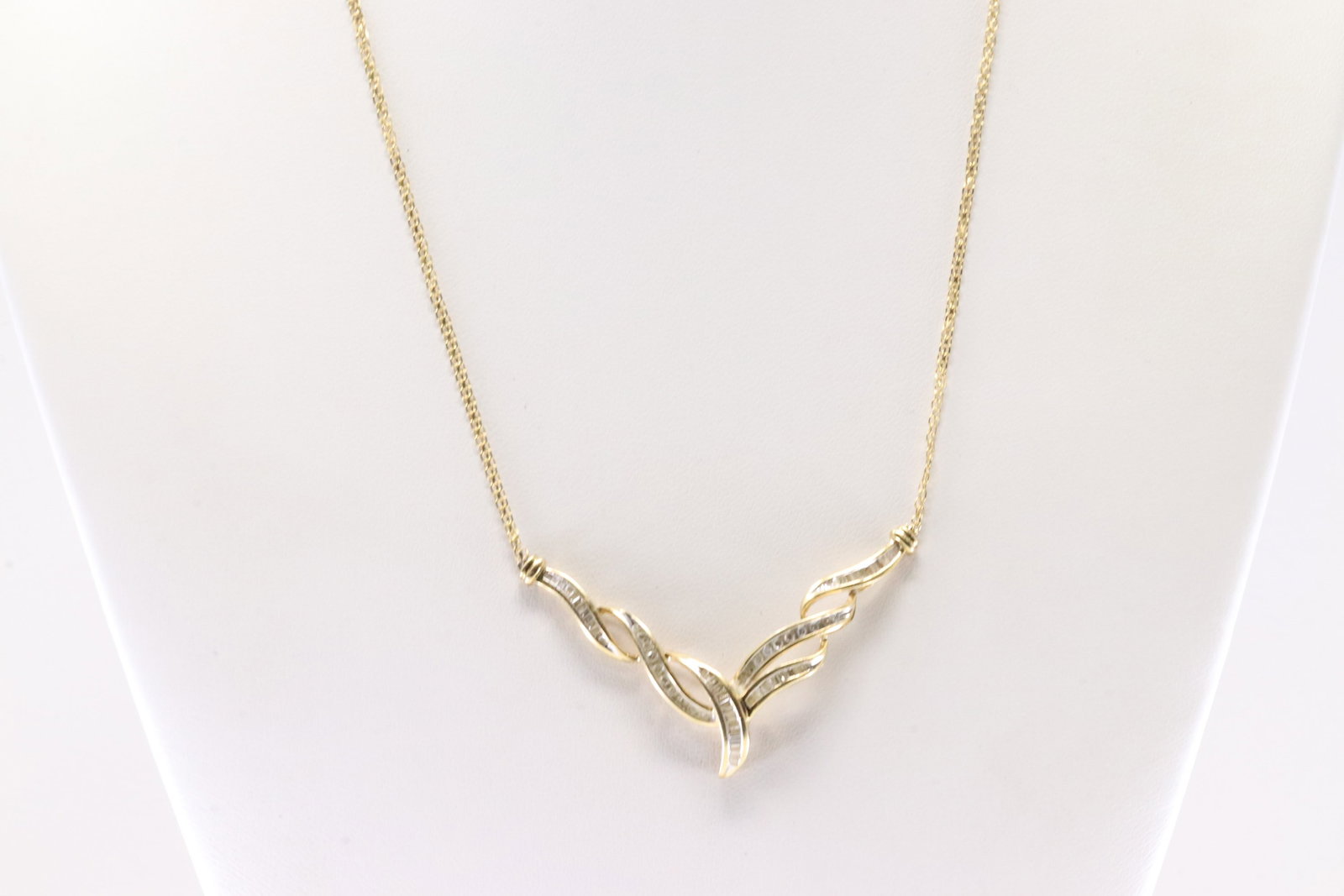 Diamond Necklace 14Kt.: Ladies 14Kt Yellow Gold Diamond Necklace. This Necklace has Gorgeous Charm With Baguette & Round Sparkling Diamonds. Diamond Approx Weight: 1.00ctw. Necklace Length: 16.00. Total Weight: 4.90 Grams.