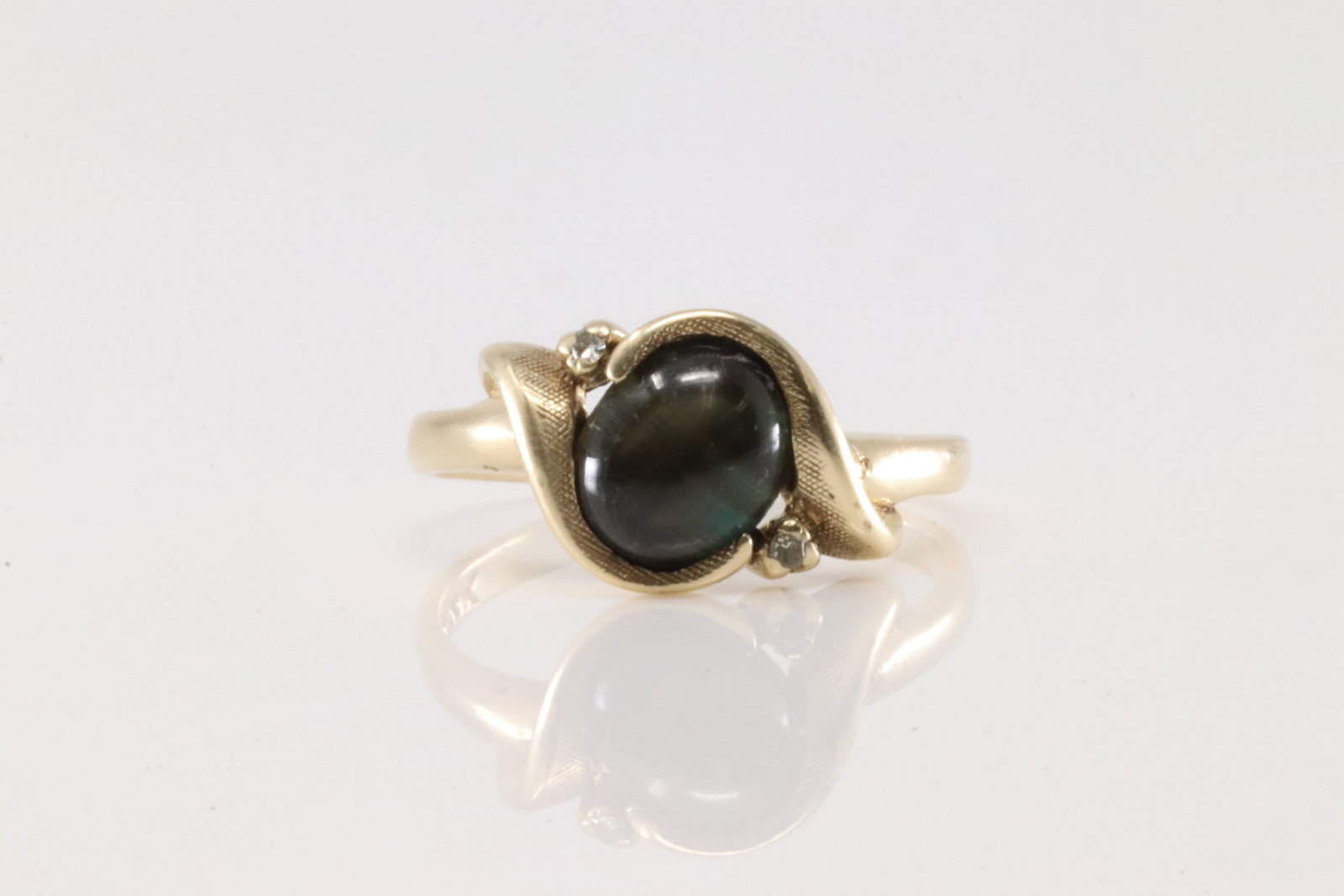 Moonstone & Diamond Ring 14Kt.: 14Kt Yellow Gold Moonstone & Diamond Ring. This ring has one moon gemstone with 2 sparkling diamonds. Ring size: 7.00. Total weight: 3.00 Grams.
