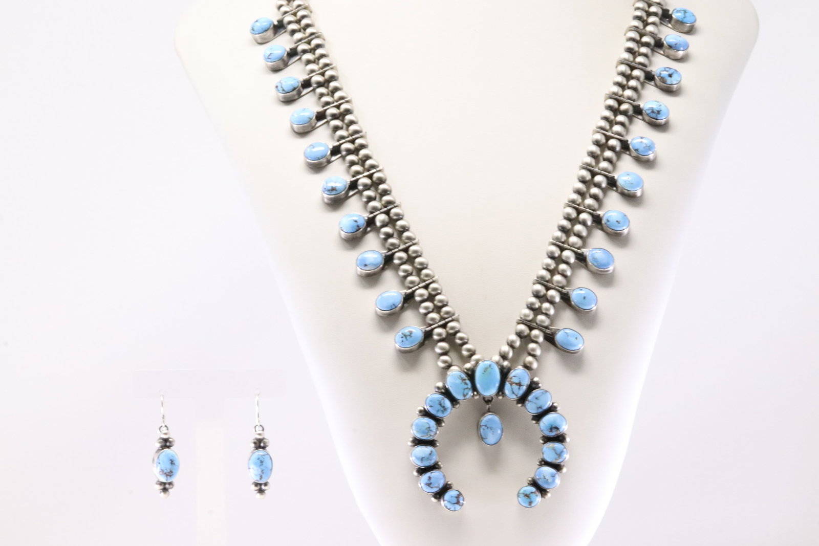 Native America Navajo Sterling Silver Golden Hill Turquoise Squash Necklace & Earring's Set By: This is a Native America Navajo Sterling Silver Golden Hill Turquoise Squash Necklace & Earring's Set By T.Smith. Necklace length: 28.00" Total weight: 145.04 Grams.