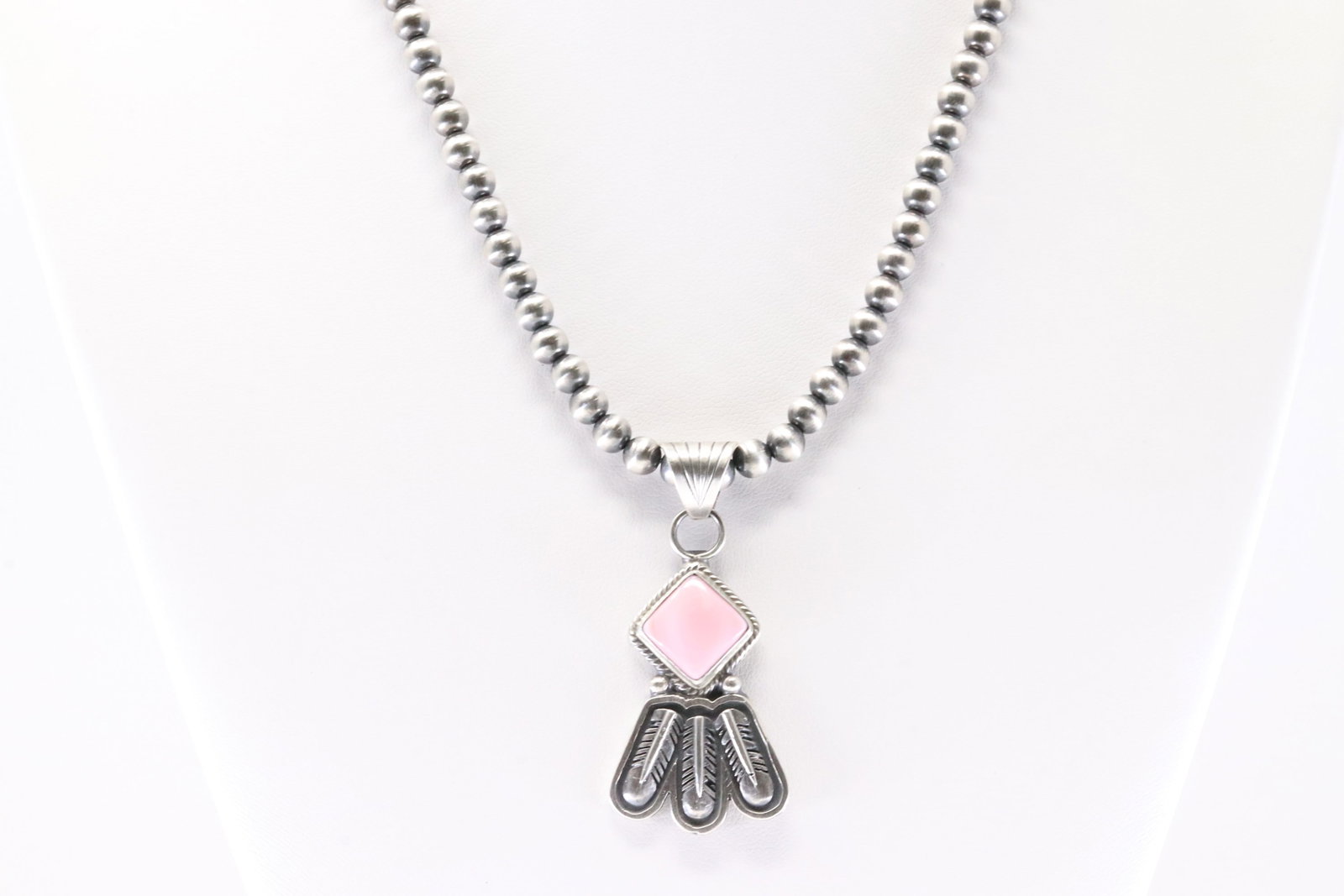 America Sterling Silver Pink Conch Shell Pendant. With Pearl Beaded Sterling Silver Machine Made: This is a America Sterling Silver Pink Conch Shell Pendant. With Pearl Beaded Sterling Silver Machine Made Necklace. Necklace length: 16.00"