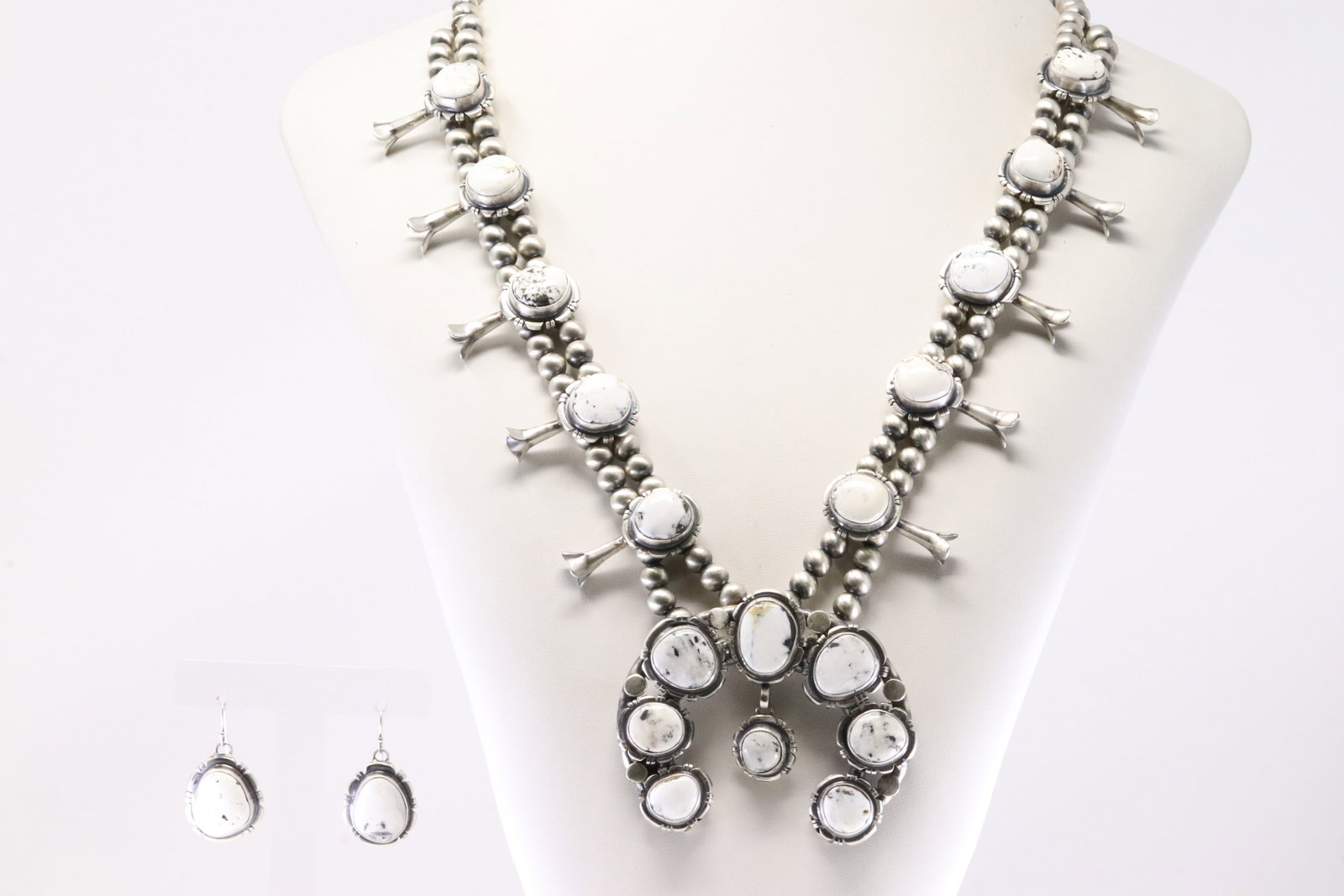 Native America Navajo Sterling Silver White Buffalo Squash Blossom Necklace & Earring's Set By: This is a Native America Navajo Sterling Silver White Buffalo Squash Blossom Necklace & Earring's Set By Thomas Francisco. Necklace length: 28.00"