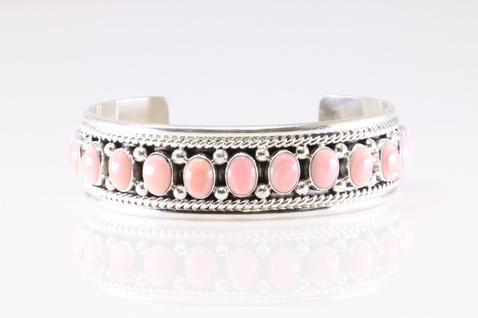 Native America Navajo Sterling Silver Pink Conch Shell Bracelet Cuff By C.Charley.: This is a Native America Navajo Sterling Silver Pink Conch Shell Bracelet Cuff By C.Charley. Stamp C Charley.