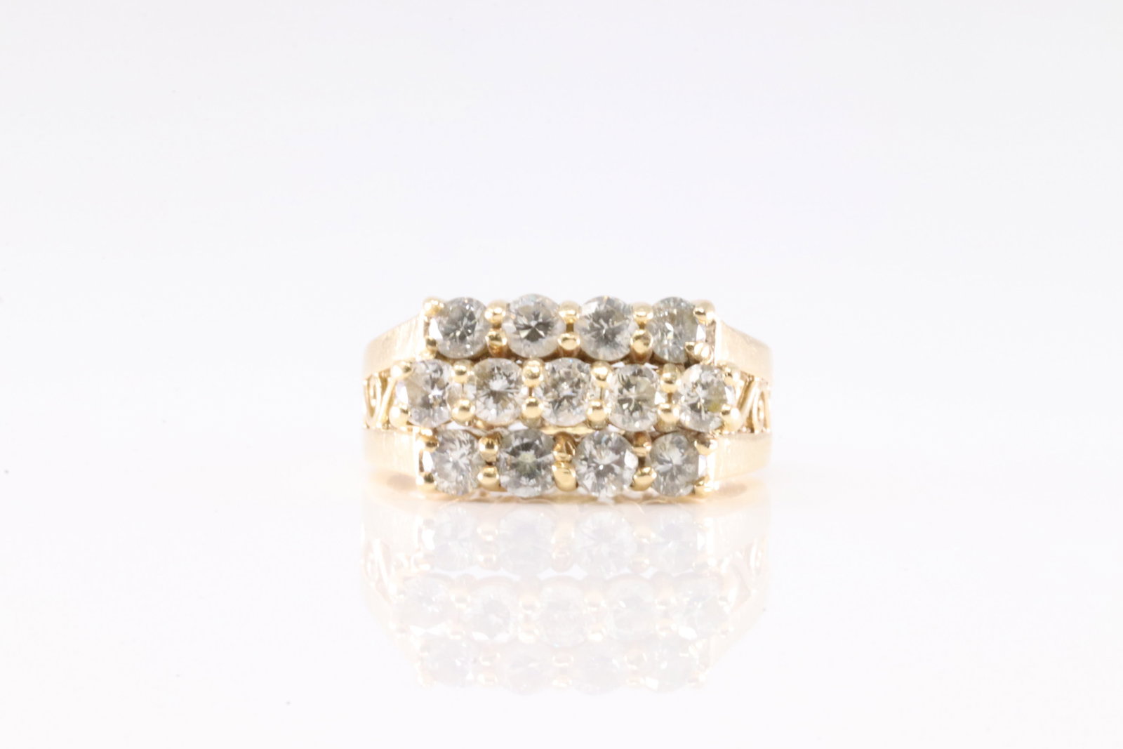 Diamond Ring 14Kt.: Ladies 14Kt Yellow Gold Diamond Ring. This Elegant Ring has 13 Round Sparkling Diamonds. Diamond Weight Approx:0.45 ctw Ring Size: 4.50. Total Weight: 4.77 Grams.