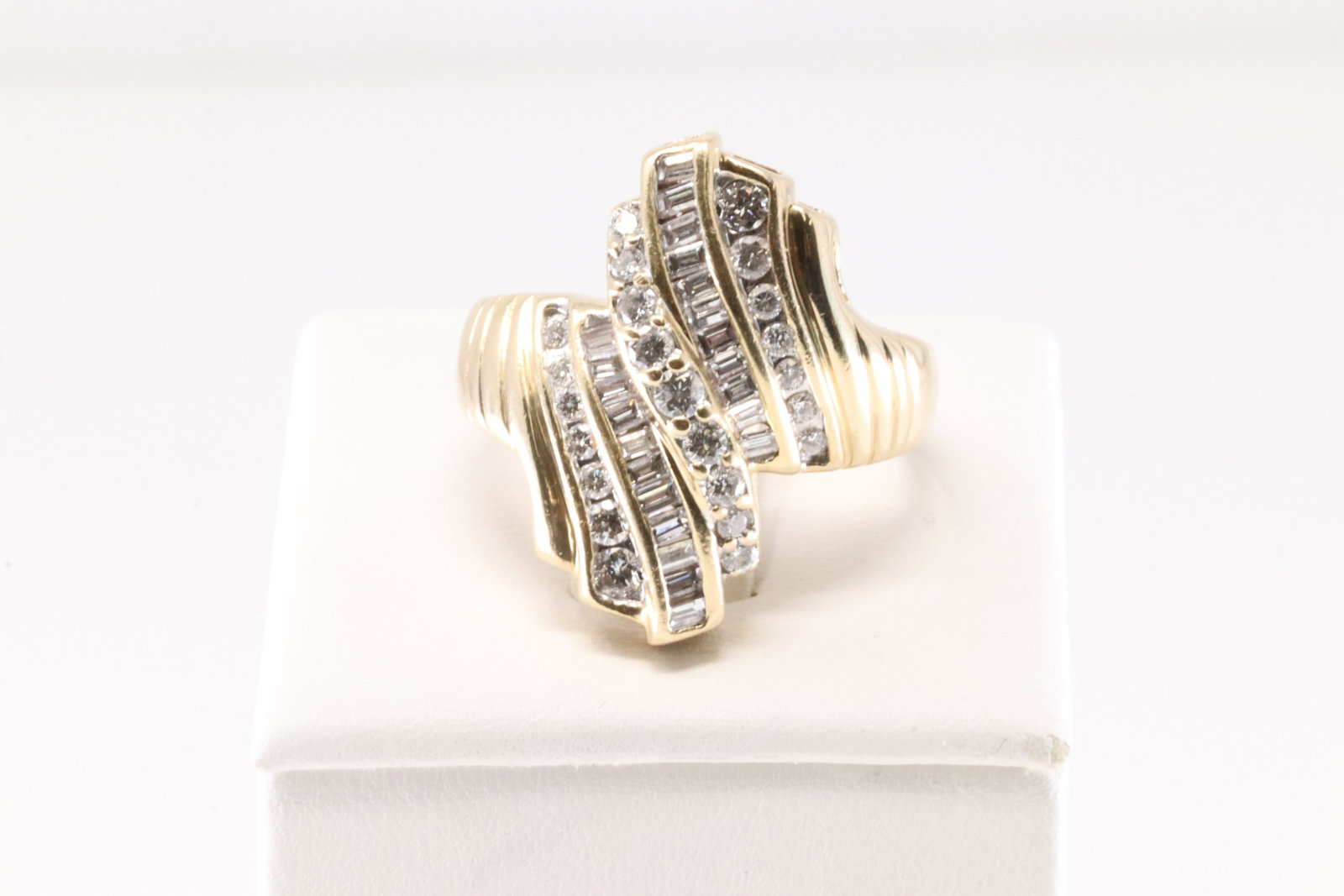 Diamond Ring 14Kt.: Ladies 14Kt Yellow Gold Diamond Ring. This Elegant Ring has 45 Brilliants Baguette & Round Diamonds. Diamonds weight approx: 2.00cttw.Ring size: 9.75. Total weight: 7.80 Grams.