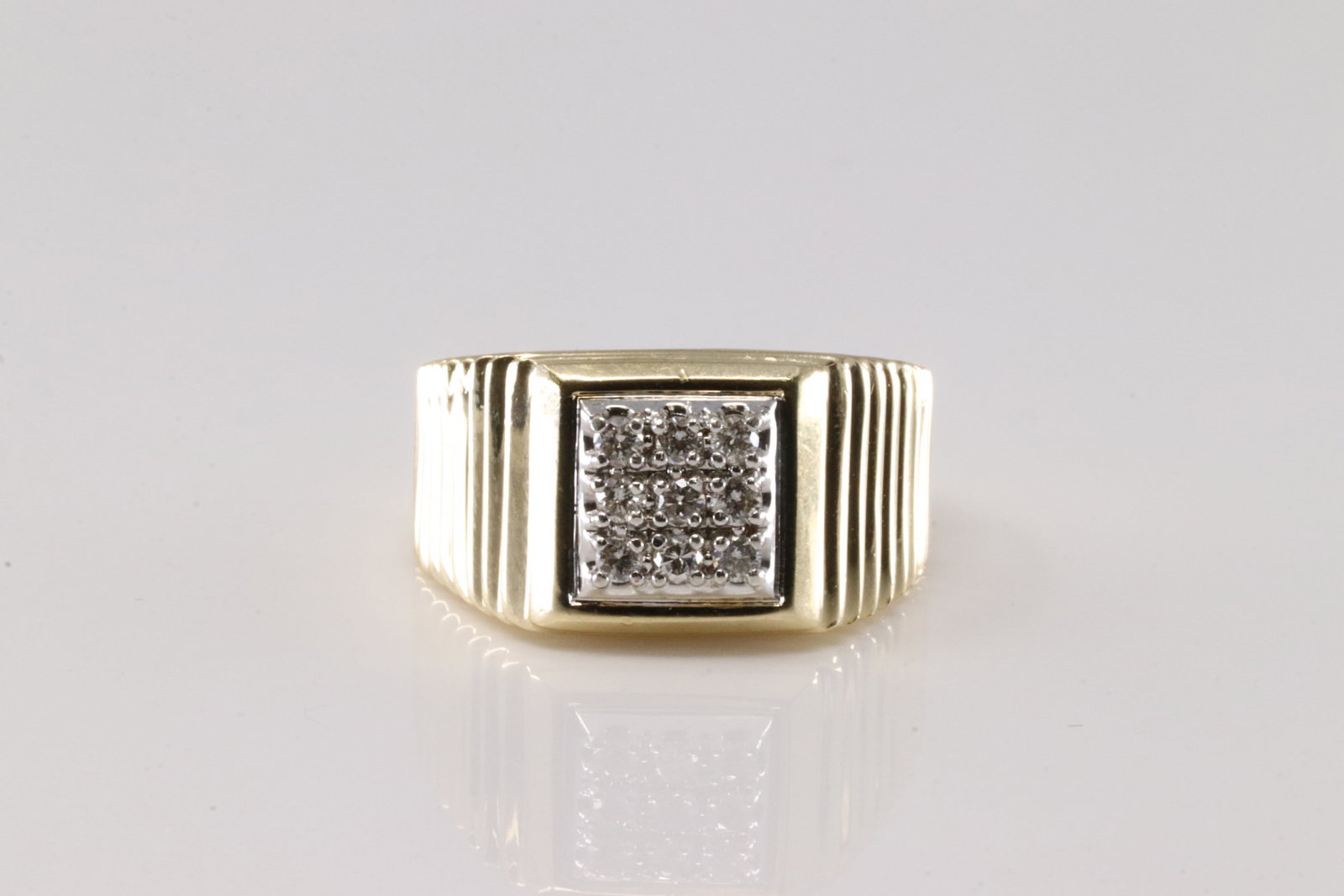 Men's Diamond Ring 14Kt.: 14Kt Yellow Gold Diamond Ring. This Elegant Ring has 3 Row with 9 Brilliants Diamonds. Diamonds weight Approx: 0.25ctw. Ring size: 9.00. Total weight: 7.80 Grams.