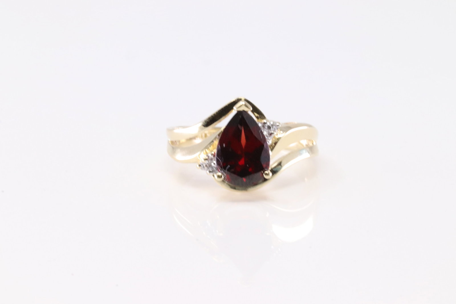 Ruby & Diamond Ring 14Kt.: Ladies 14Kt Yellow Gold Ruby & Diamond Ring. This Elegant Ring has Tear Drop Ruby Gemstones & 6 Round Sparkling Diamonds. Ring Size: 6.50. Total Weight: 4.19 Grams.