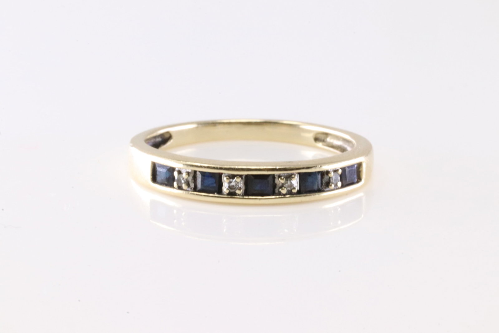 Sapphire & Diamond Ring 10Kt.: Ladies 10Kt Yellow Gold Sapphire & Diamond Ring. This Beautiful Ring has 5 Sapphire Gemstones & 4 Round Sparkling Diamonds. Ring Size: 6.50.