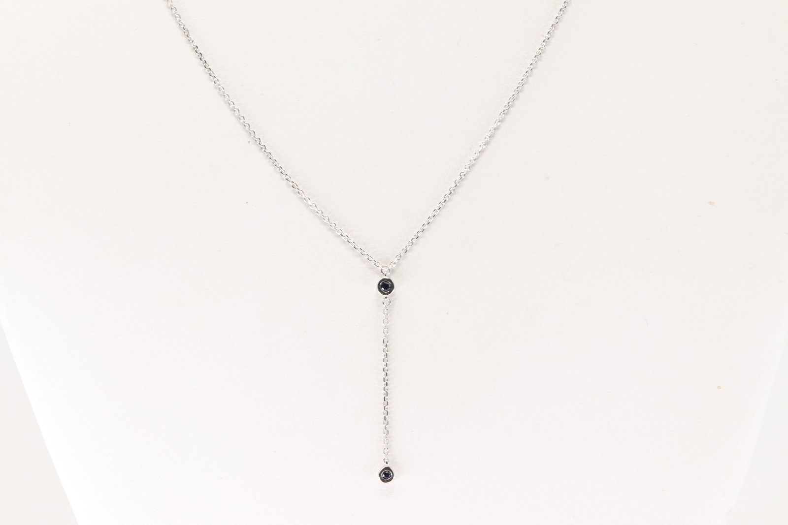 Sapphire Necklace 14kt.: Ladies 14kt White Gold Sapphire Necklace. Neccklace With 2 Blue Sapphire Gems, Adjustable. Sapphire Weight: 0.07ct. Necklace Length: 18.00".