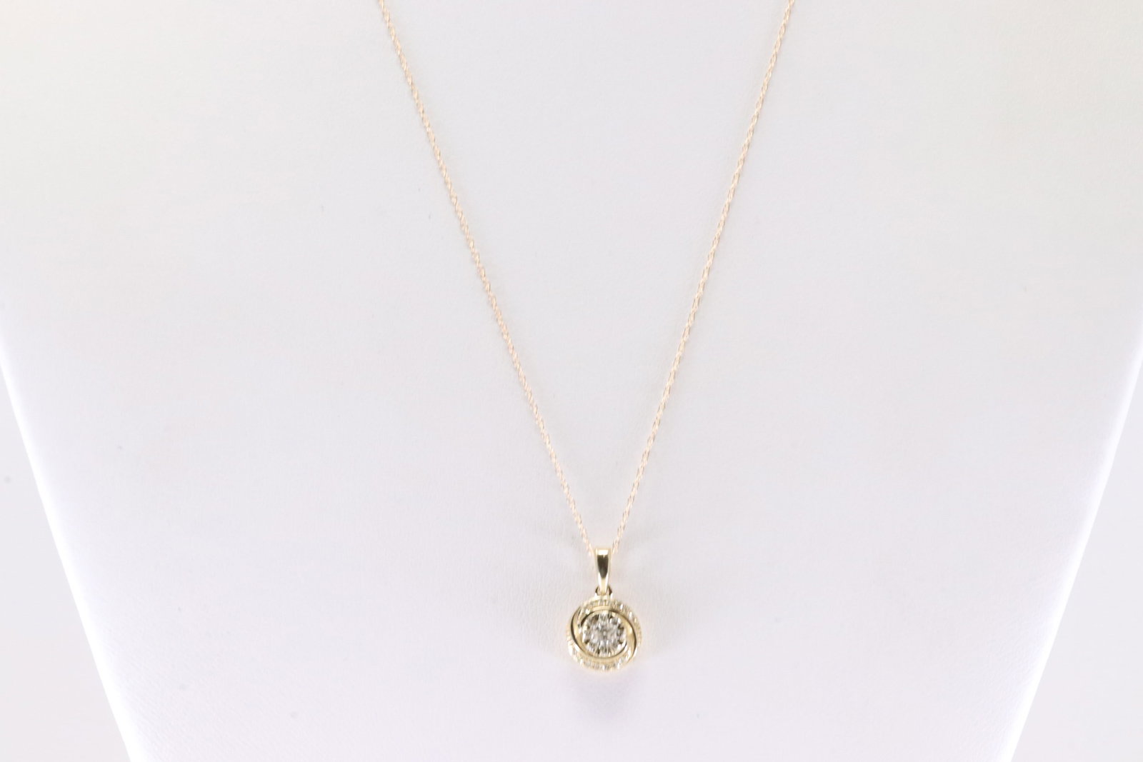 Diamond Pendant / Necklace 10Kt.: Ladies 10Kt Yellow Gold Diamond Pendant / Necklace. This Necklace has Beautiful Pendant With 23 Round Sparkling Diamonds. Diamond Approx Weight: 0.25ctw. Necklace Length: 18.00.