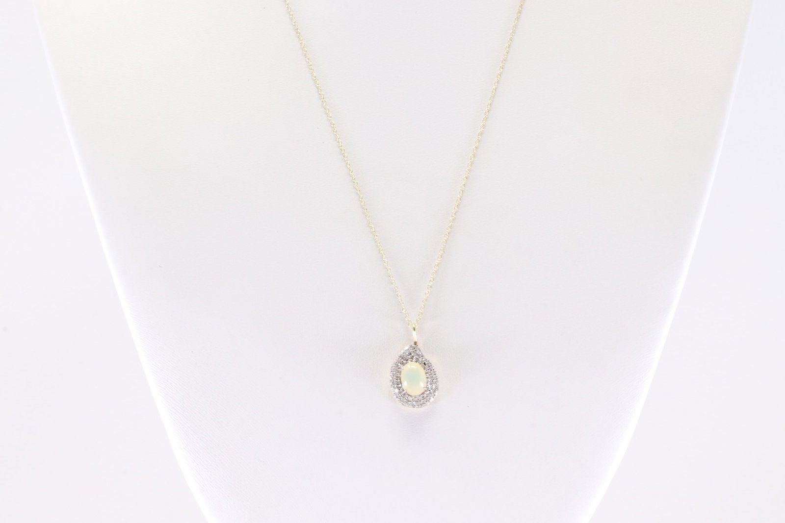 Opal & Diamond Pendant / Necklace 10Kt.: Ladies 10Kt Yellow Gold Opal & Diamond Pendant / Necklace. This Necklace has a Pendant With Opal Gemstones Surrounded By Round Diamonds. Diamond Approx Weight: 0.35ctw. Necklace Length: 18.00. Total